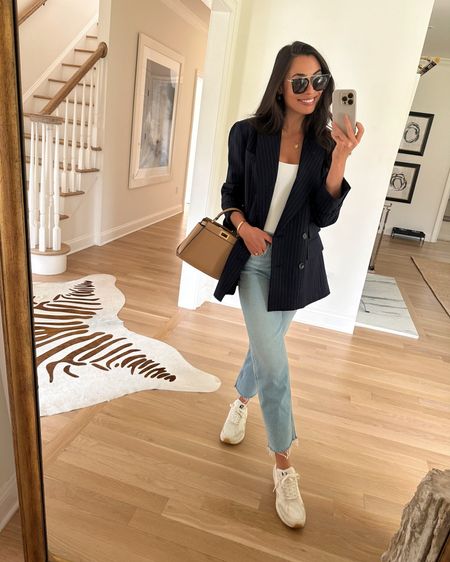 Kat Jamieson wears a blazer, denim jeans, sneakers, bodysuit and Fendi Peekaboo bag. Spring outfit, casual outfit, workwear, office style, blazer outfit. 

#LTKitbag #LTKSeasonal #LTKshoecrush