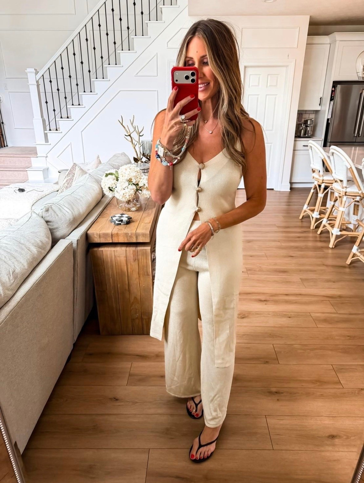 I wore this neutral knit set on a day when I wanted to feel comfortable but still look intentional. The long button front top creates a flattering vertical line, while the wide leg pants have an easy drape that keeps the outfit from feeling too fitted. I also love that both pieces can be styled separately, which makes the set feel much more versatile.

neutral matching set, knit set, wide leg pants, longline top, summer outfit, travel outfit, elevated casual style, monochromatic outfit, comfortable fashion, themominstyle

#LTKootd #LTKSeasonal #LTKOver40