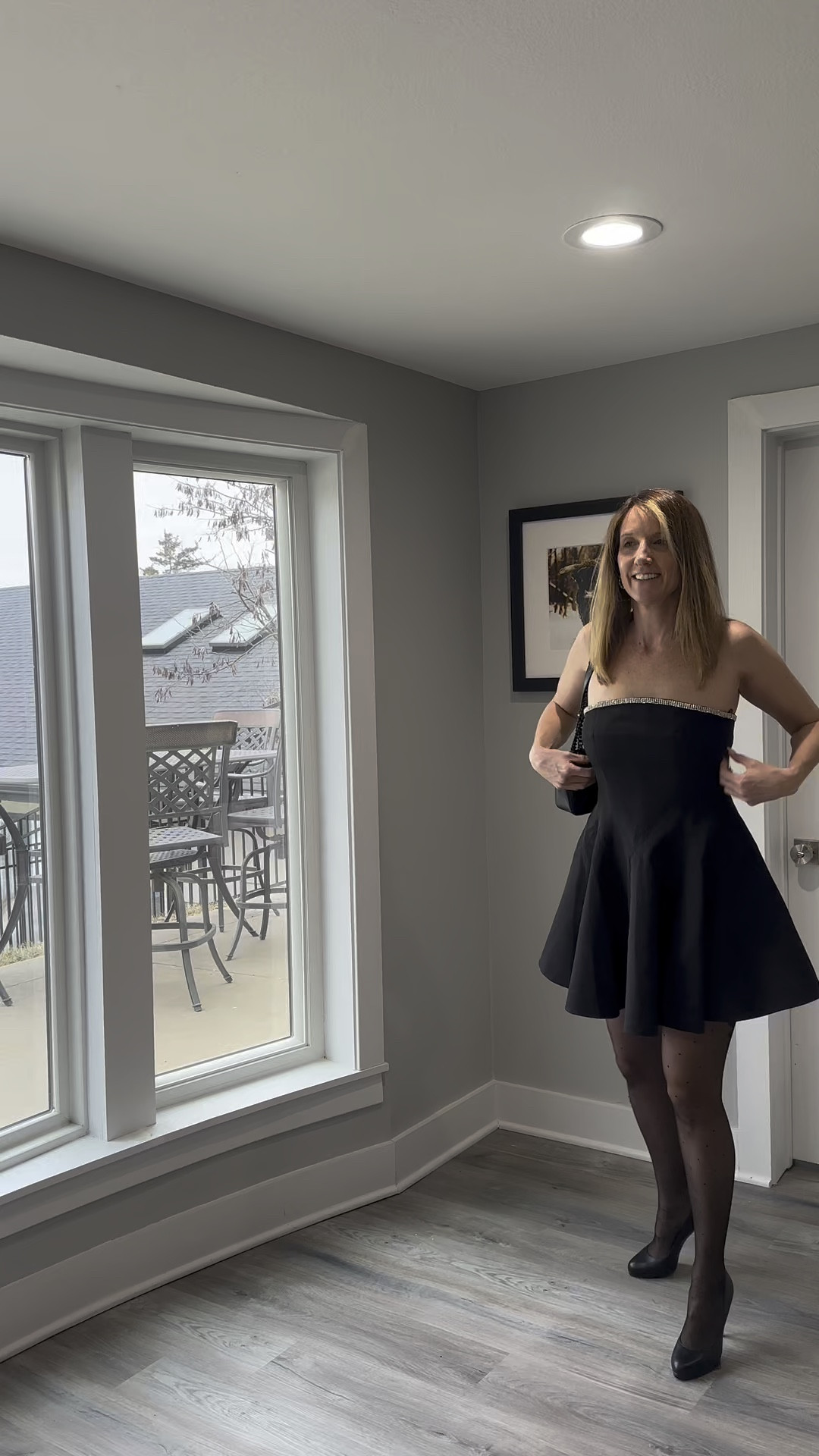 If you’re looking for a sign to invest in a structured mini, this is it. 🖤🧥 I love how the volume of this skirt balances the sleek bodice for a look that feels completely high-end. It’s all about those small, intentional luxuries—like a bit of sparkle at the neckline—that make a staple piece pop! Tap the link in my bio to snag this closet favorite. 🌟👠 #StyleInspo #BlackMiniDress #EveningGlam #LTKfind

strapless black mini dress, crystal trim neckline dress, flared black mini skirt, sheer patterned tights, black platform pumps, feminine formal attire, intentional wardrobe staples, high-end evening look, empowered woman fashion, LTKstyle, vici dolls @VICI 

#LTKootd #LTKSeasonal #LTKOver40