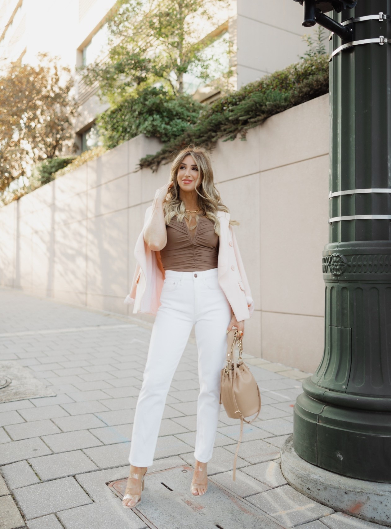 A spring outfit with white denim to try. Easily switch out the heels for sandals for a more casual look.

Spring outfits 2026, outfits with white denim jeans, pink blazer, clear heels, bucket bag

#LTKootd #LTKdayinmylife #LTKOver40