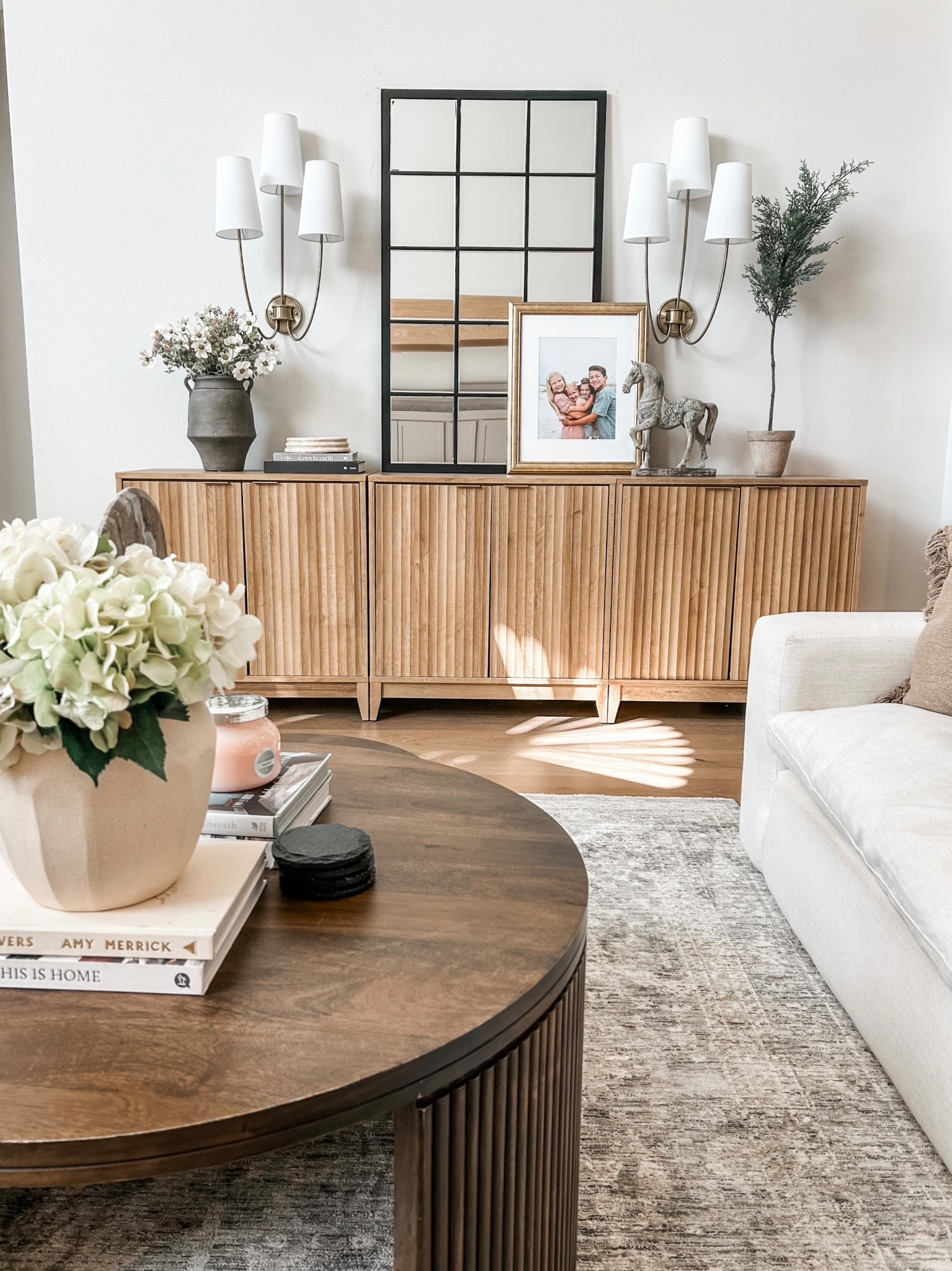 Spring decor in our family room 






Sconces, statement sconces, Loloi rug, area rug, living room rug, storage cabinets, media console, sideboard, large mirror, wall decor, round coffee table, 