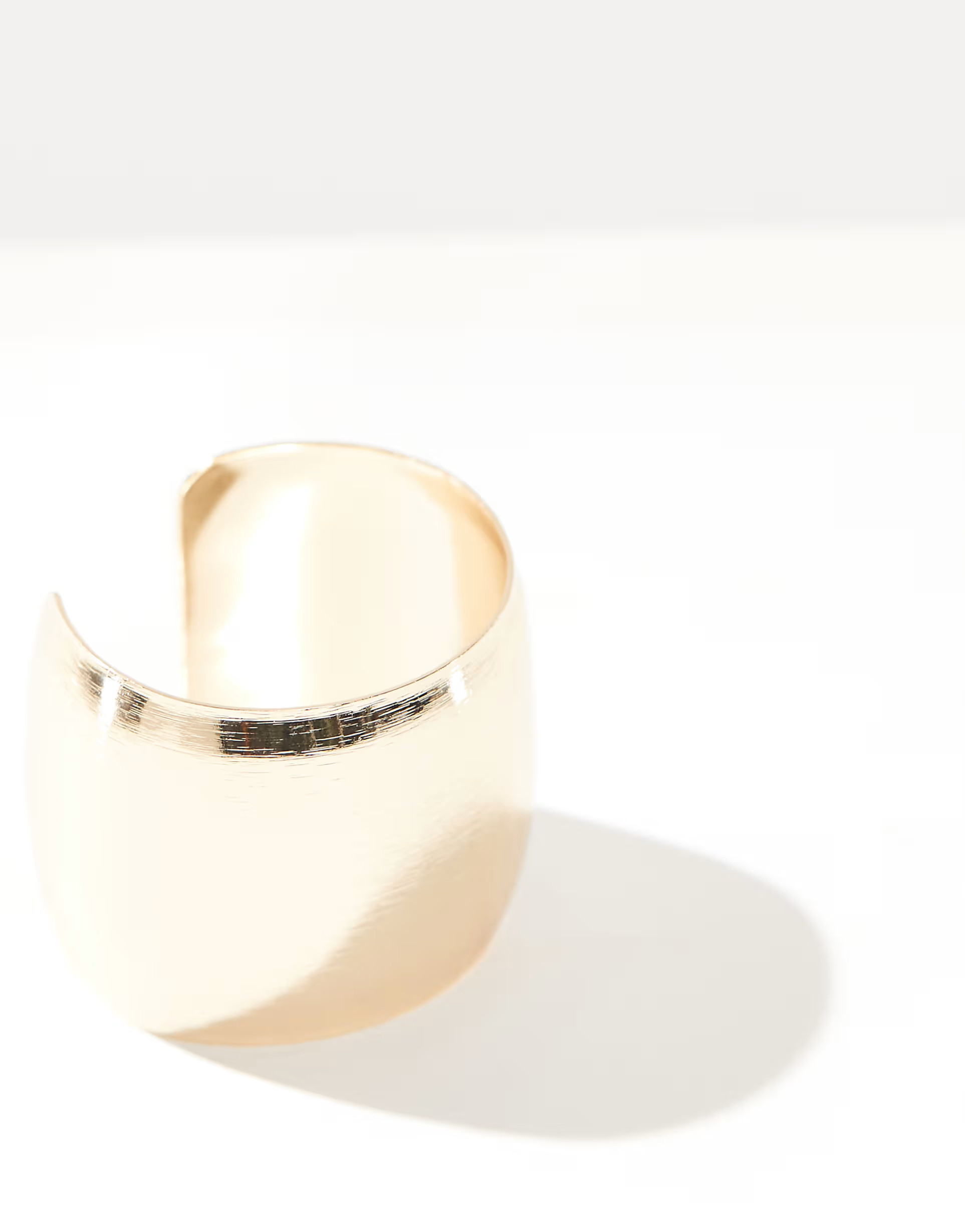 ASOS DESIGN cuff bracelet with curved detail in brushed gold tone | ASOS (Global)