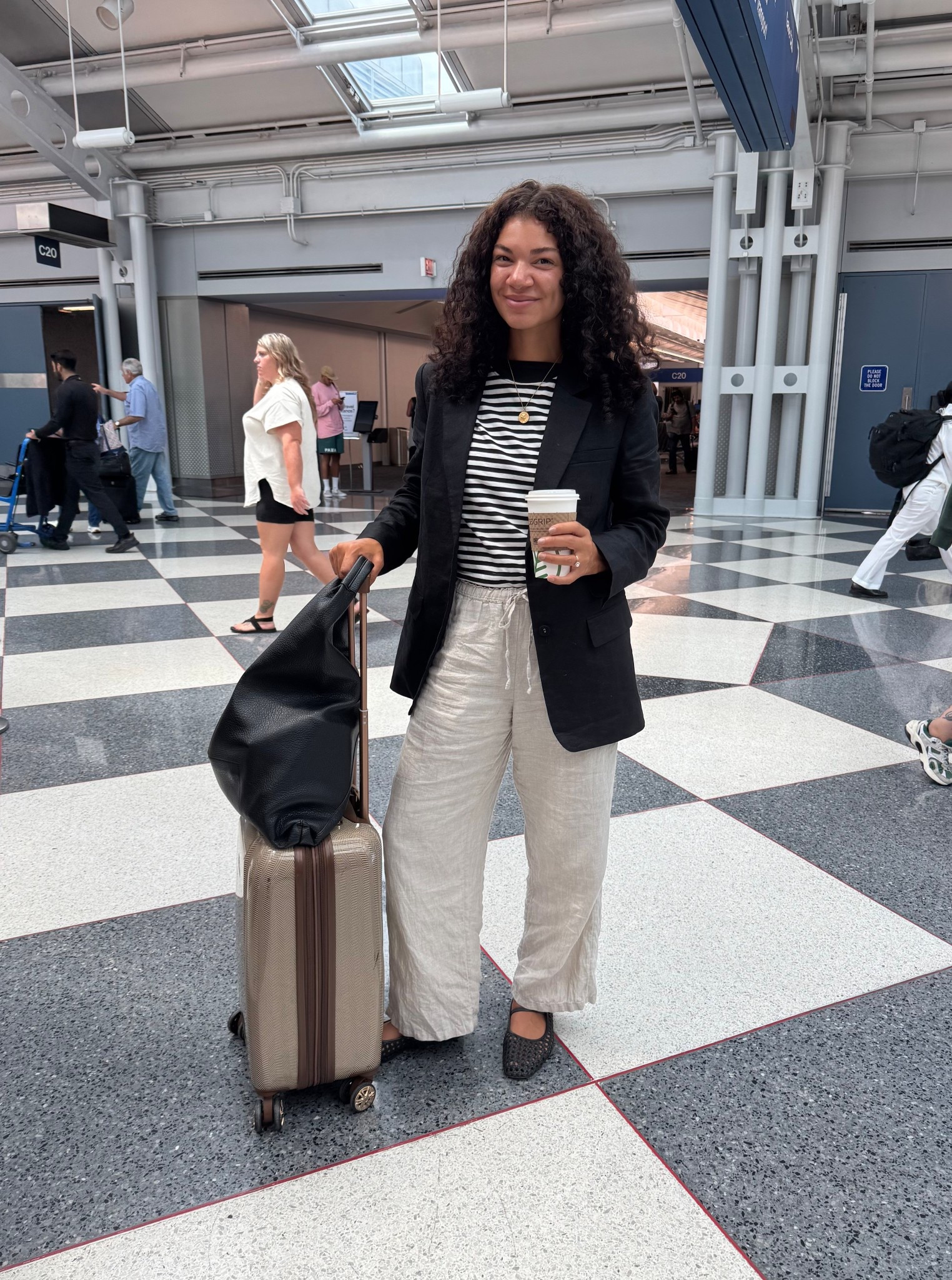 Travel outfit style: striped t-shirt, linen blazer, linen pants, woven flats, and a tote bag 

#LTKTravel #LTKFindsUnder100 #LTKStyleTip
