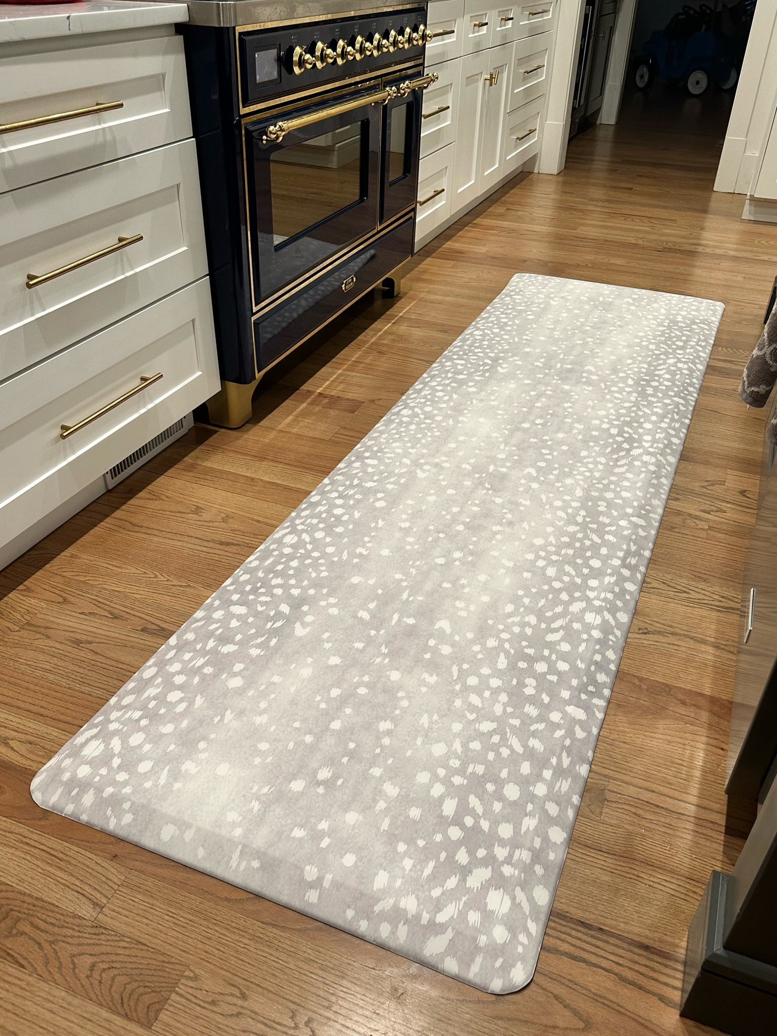 New kitchen runner mat. It’s fashionable but also functional because it’s easy to wipe down. It’s also a comfortable standing mat and feels like a cloud under your feet. This is the fawn in silver 30x108 size. 

#LTKhome