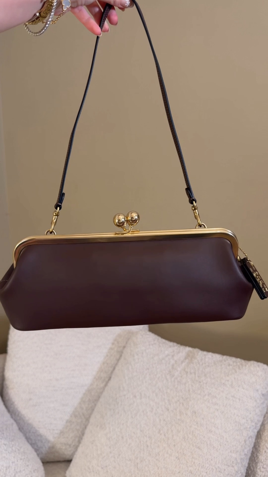 The classiest lil bag 😍 Comment SHOP & I’ll dm you the links ♥️

I love how unique the Coach Kisslock frame 30 bag is! And she’s way more practical than I expected! She’s super comfortable to carry as a shoulder bag and can be worn casually and fits everything I need for the day. She can also be dressed up as a chic lol clutch like they did on the Coach runway with the Kisslock bags.
I love the vintage Kisslock vibes too! 
I’ve gotten way more use out of this bag than I expected!