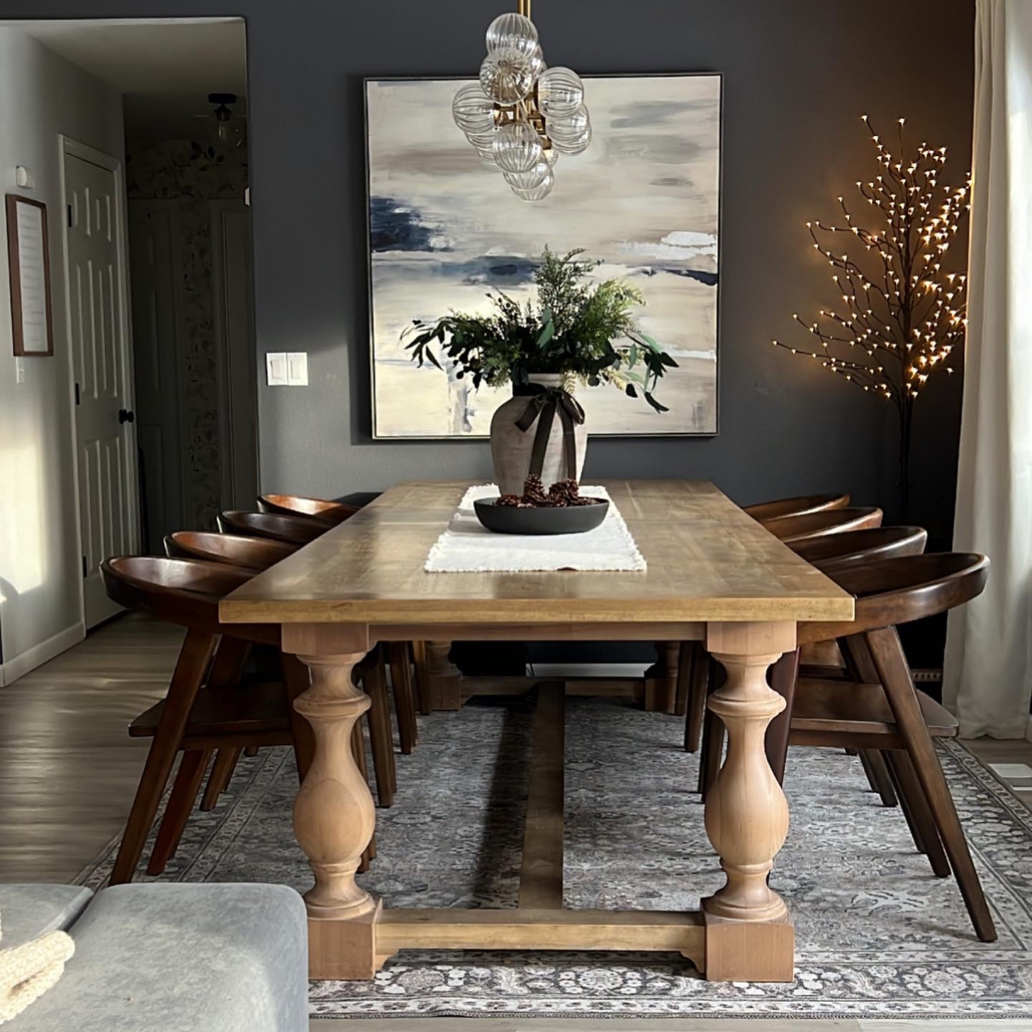 ~My Dining Room Links~
Table is from Restoration Hardware, but I’ve linked similar styles. Curtains, chairs light and washable rug are exact links. 

Boutique Rug Discount code: KELLIHOL will take 10% off (expires soon). Code KELLI will take 5% off after my other code expires. 

My prelit tree came in a set of 3. I’ve linked a singular similar option as well. 

Art is from Home Goods, I’ve linked a similar style. 

Curtains are the color: Sour cream.

Wall color is Peppercorn by SW (lightened 50%).

#diningroomchairs #diningtable 

#LTKSeasonal #LTKHoliday #LTKhome