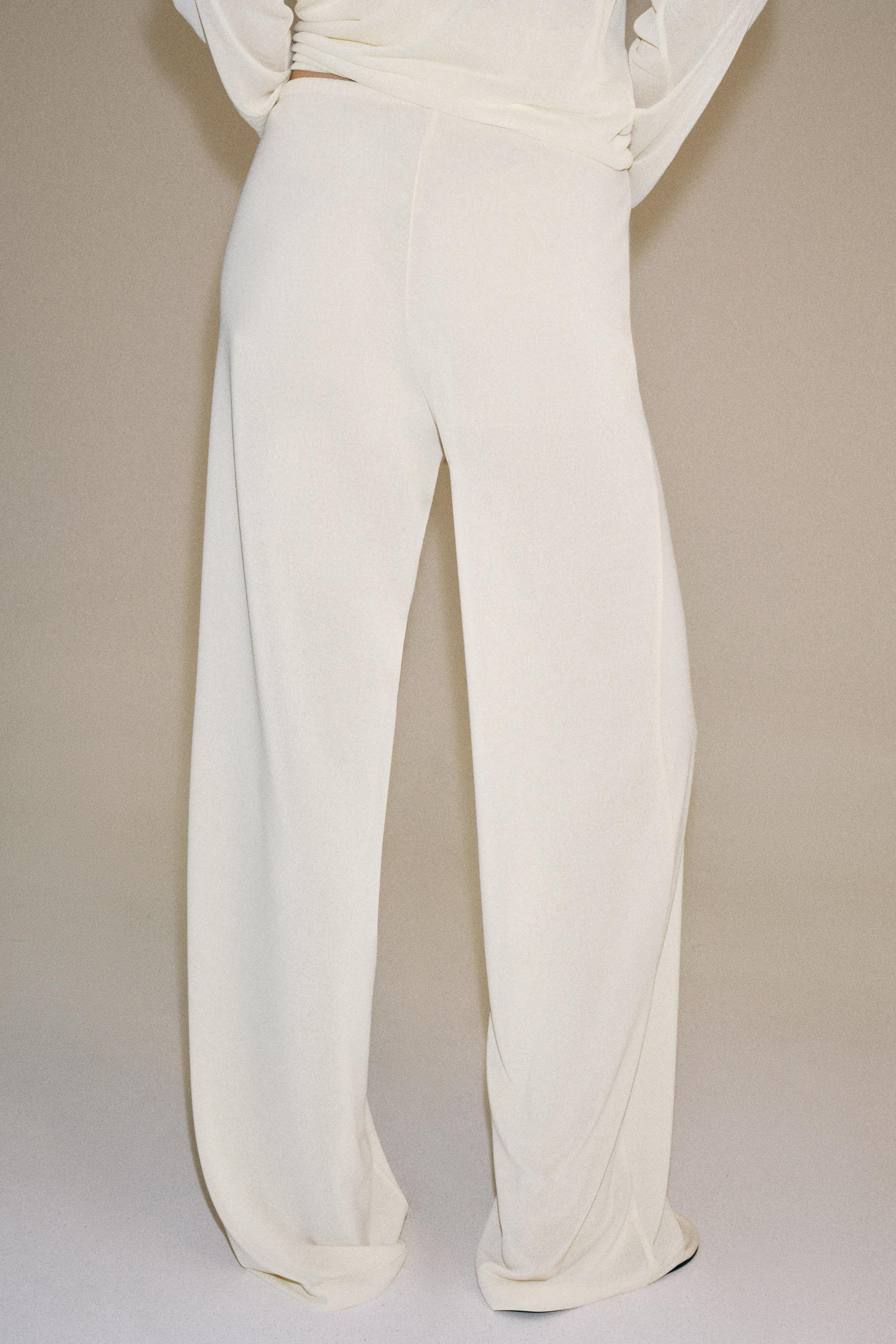 Model height: 176 cmTrousers crafted from a semi-sheer fabric. Mid-waist design with an adjustabl... | Zara UK