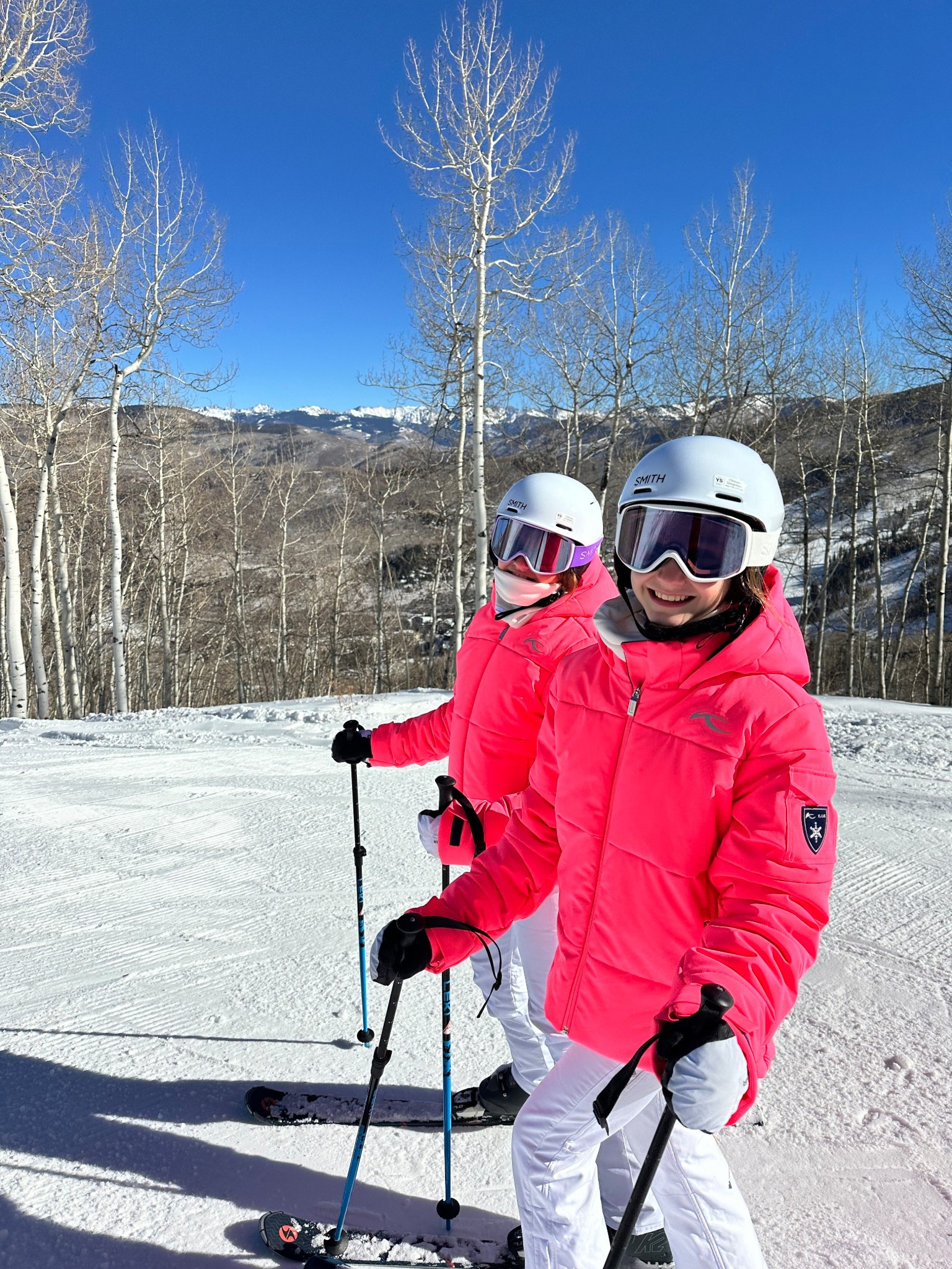 The girls neon ski coats by #kjus They are so warm and I can spot them easily! I love those chic #skicoats 