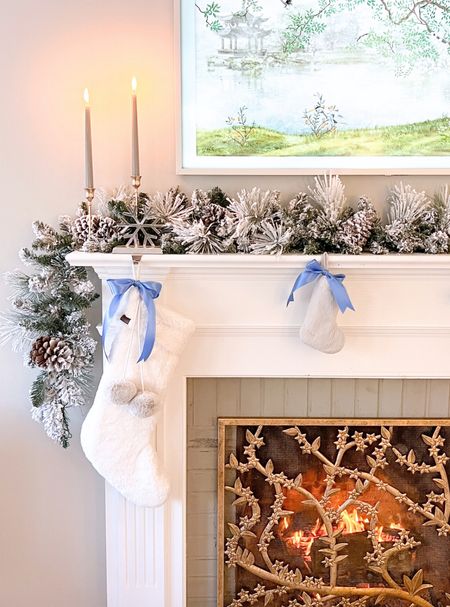 Blue & White Grandmillennial Christmas Fireplace mantle styling. Flocked garland, taper candlesticks, gold fireplace screen, Christmas stockings, French blue satin ribbon. 

#LTKhome #LTKSeasonal #LTKHoliday