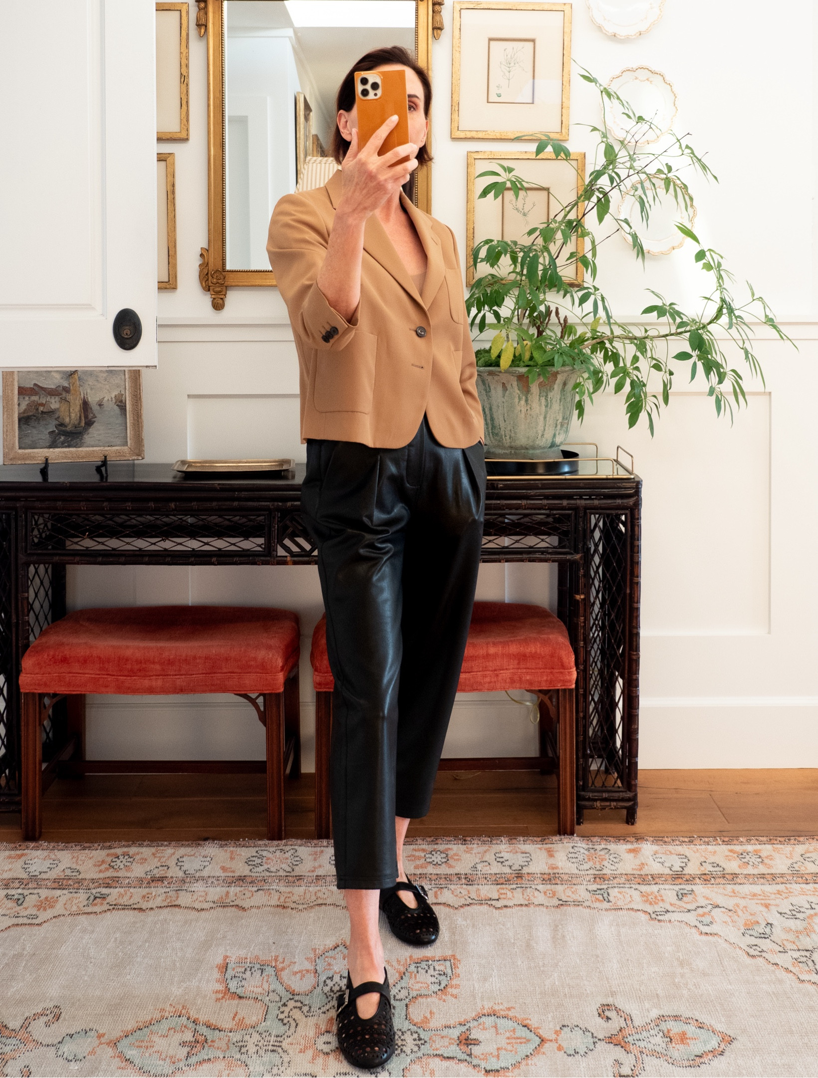 Wearing a trio of old pieces for a fresh fall look.⁠
⁠
The cropped Dries Van Noten camel jacket is from spring. Who knew that would be the color I'd be focusing on for fall? I love wearing jackets with nothing underneath...maybe just a tank.⁠
⁠
I talked about these Brochu Walker vegan leather pants last September. Ended up getting them in brown too. Another great silhouette for California and other warm weather fall locations. 
⁠
Somewhat newish are the Alaia perforated Mary Janes. They're as comfortable as the simple Ava style I have from The Row, but add a little more personality with the pattern.⁠
⁠
When I love a piece I know I'll wear a lot, I often buy it in another color. That goes for this look. I also have the Dries jacket in black and the BW pants in brown.⁠
⁠
#falldressing #whattoewear 

#LTKSeasonal #LTKStyleTip