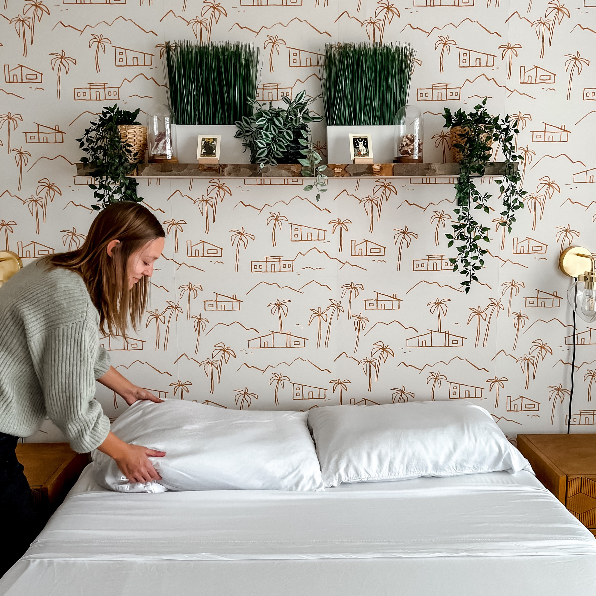 We call this the Palm Springs room 🌴

Our cozy little guest room came together so perfectly with a statement wall of fun peel and stick wallpaper, organic non-toxic bedding, and a natural edge shelf packed with fake plants, crystals, and cat tarot cards! We try to bring our personality to every room in our home, and I say this room was no exception! #guestbedroom #bedroomdecor #peelandstickwallpaper 

#LTKhome #LTKunder100 #LTKFind