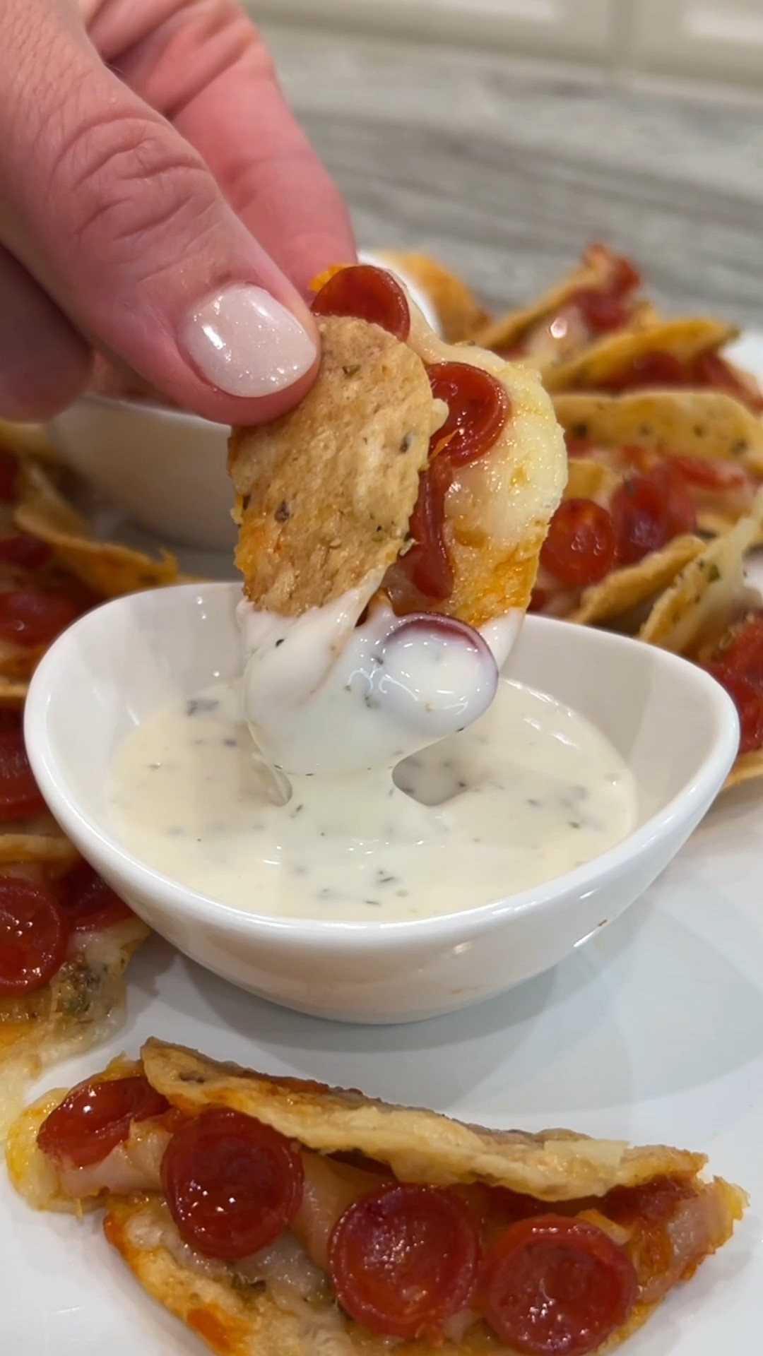 Pizza Taco Bites 😋🌮🍕 Tortilla chips dipped in garlic butter get topped with pizza sauce, Italian cheese blend and mini pepperoni

#LTKParties