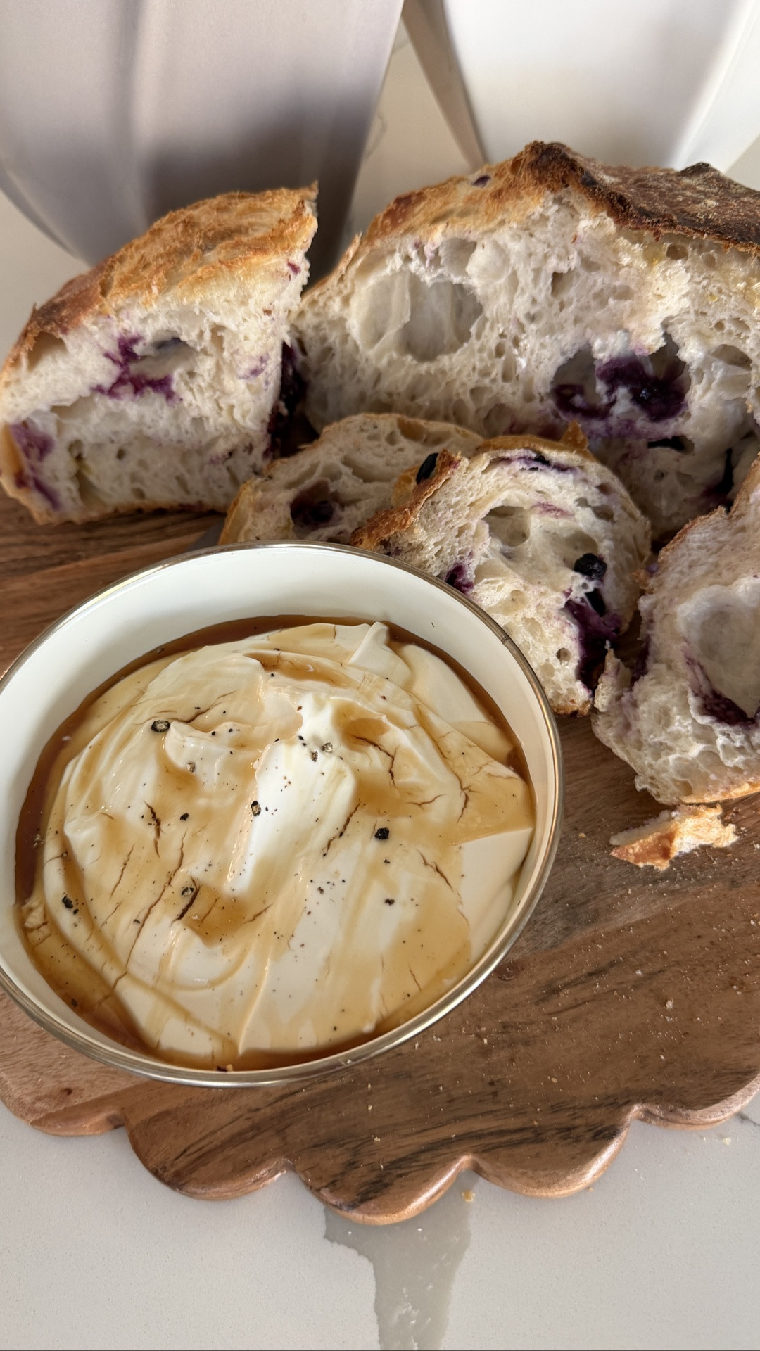 Serving a blueberry lemon sourdough loaf with whipped lemon ricotta on our scallop cutting board that doubles as a serving board because it’s so beautiful! Love pieces like this that can go from prep to serving. Also linking the MacKenzie-Childs everyday bowls we use literally multiple times a day!

#LTKHome #LTKdayinmylife