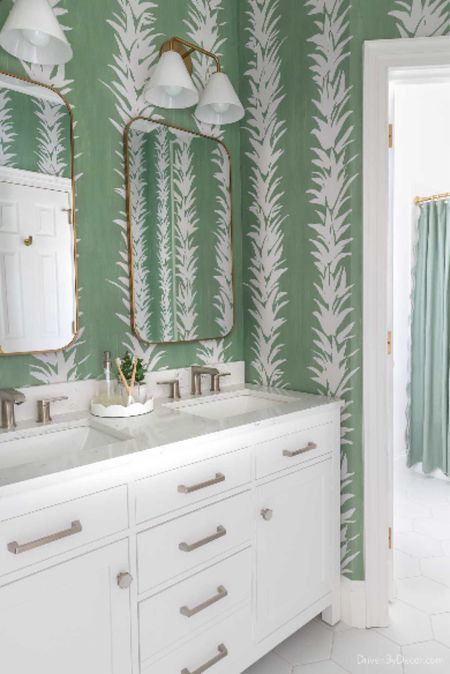 Our Jack and Jill bathroom remodel with double vanity, medicine cabinet mirrors, double sconces, and green and white wallpaper. 

Bathroom makeover, bathroom ideas, bathroom renovationn

#LTKfindsunder50 #LTKhome #LTKfindsunder100