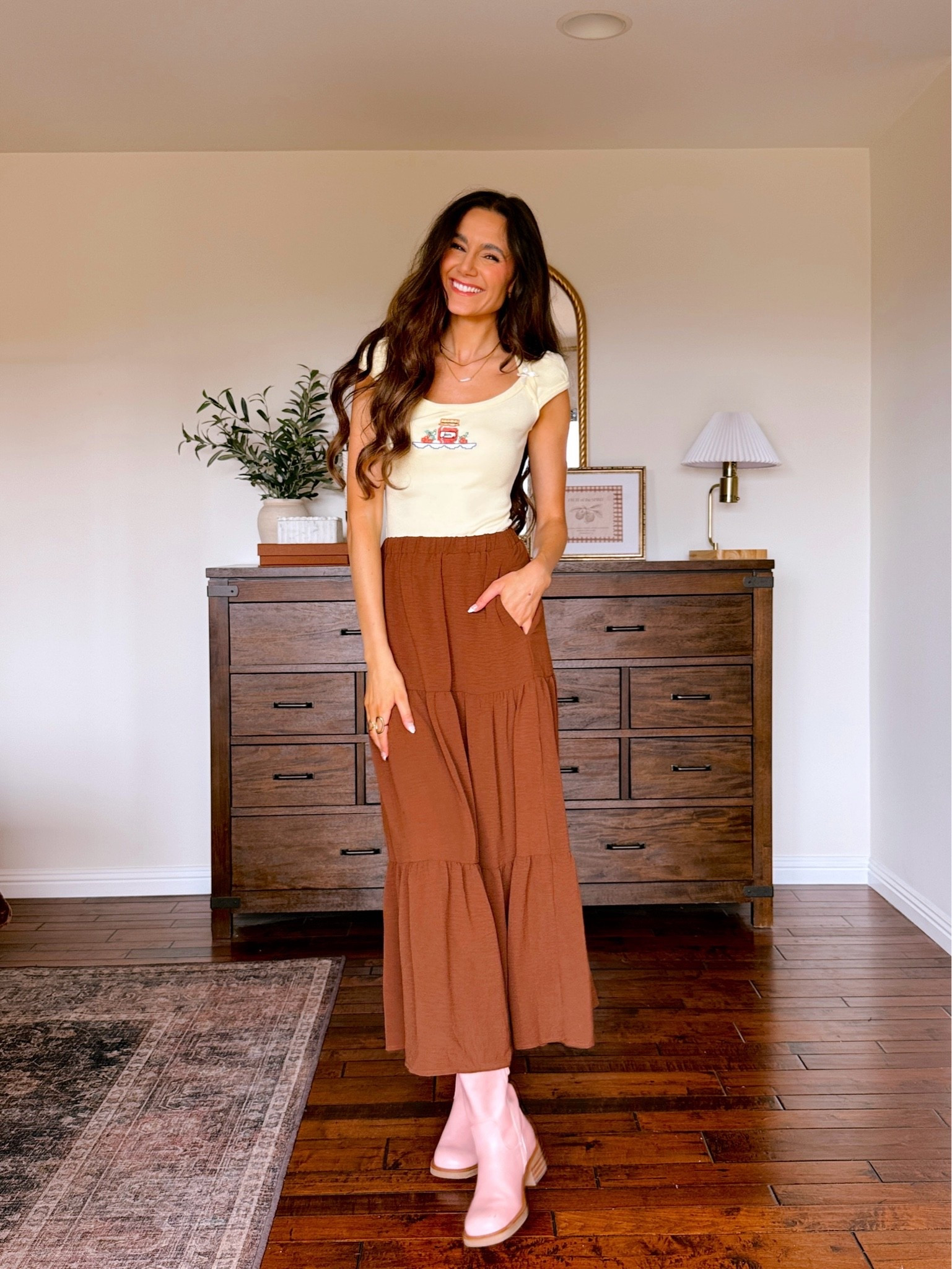 Wearing an XS in the top and a S in the skirt. Boots fit true to size.