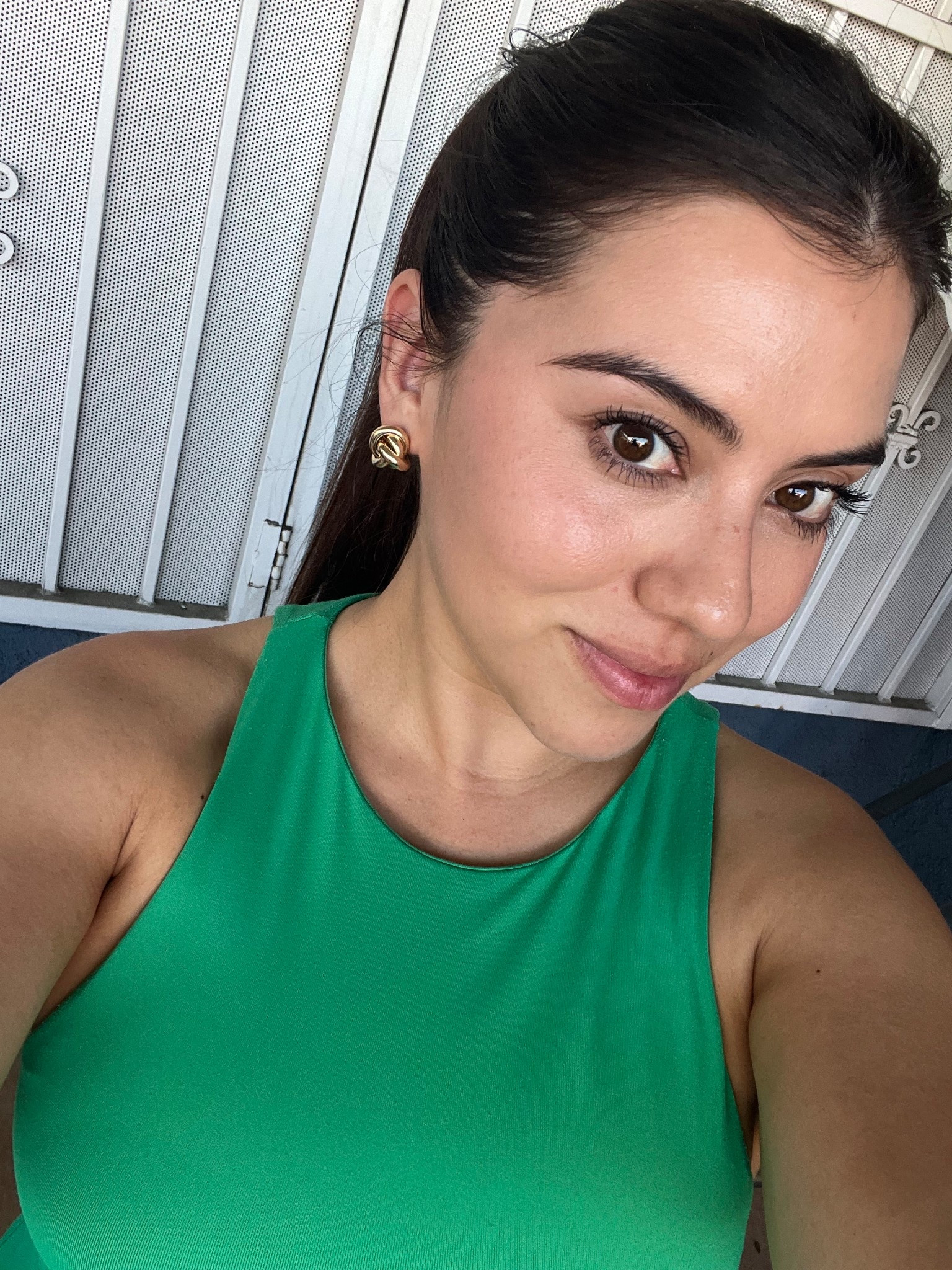 This bold green high-neck top is the perfect pop of color for spring and summer, creating a fresh and flattering look. I paired it with classic gold knot earrings for a timeless, elevated touch—perfect for any day-to-night outfit on LTK.

#LTKTravel #LTKSeasonal #LTKStyleTip