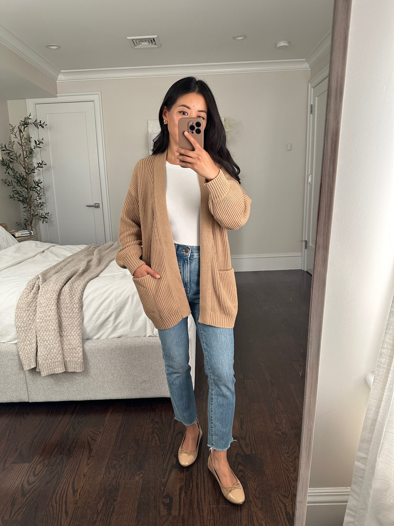 Such a good value for this 100% organic cotton oversized cardigan. 

• trying on quince cardigan in camel xs - oversized, relaxed fit with drop shoulders. Slightly balloon style sleeves that are surprisingly not too long on me in the xs! Thicker weight

• Amazon bodysuit xs 

• Madewell perfect vintage jeans size 24 regular, hems cut, old wash so I linked the exact style in the current washes  

I get regular sizing for the higher rise and then cut the hems. These have a slim slightly tapered leg

• Jeffrey Campbell flats 5.5. Linked another more luxe brand of cap toe flats that’s on my wishlist!

#LTKFindsUnder50

#LTKSeasonal