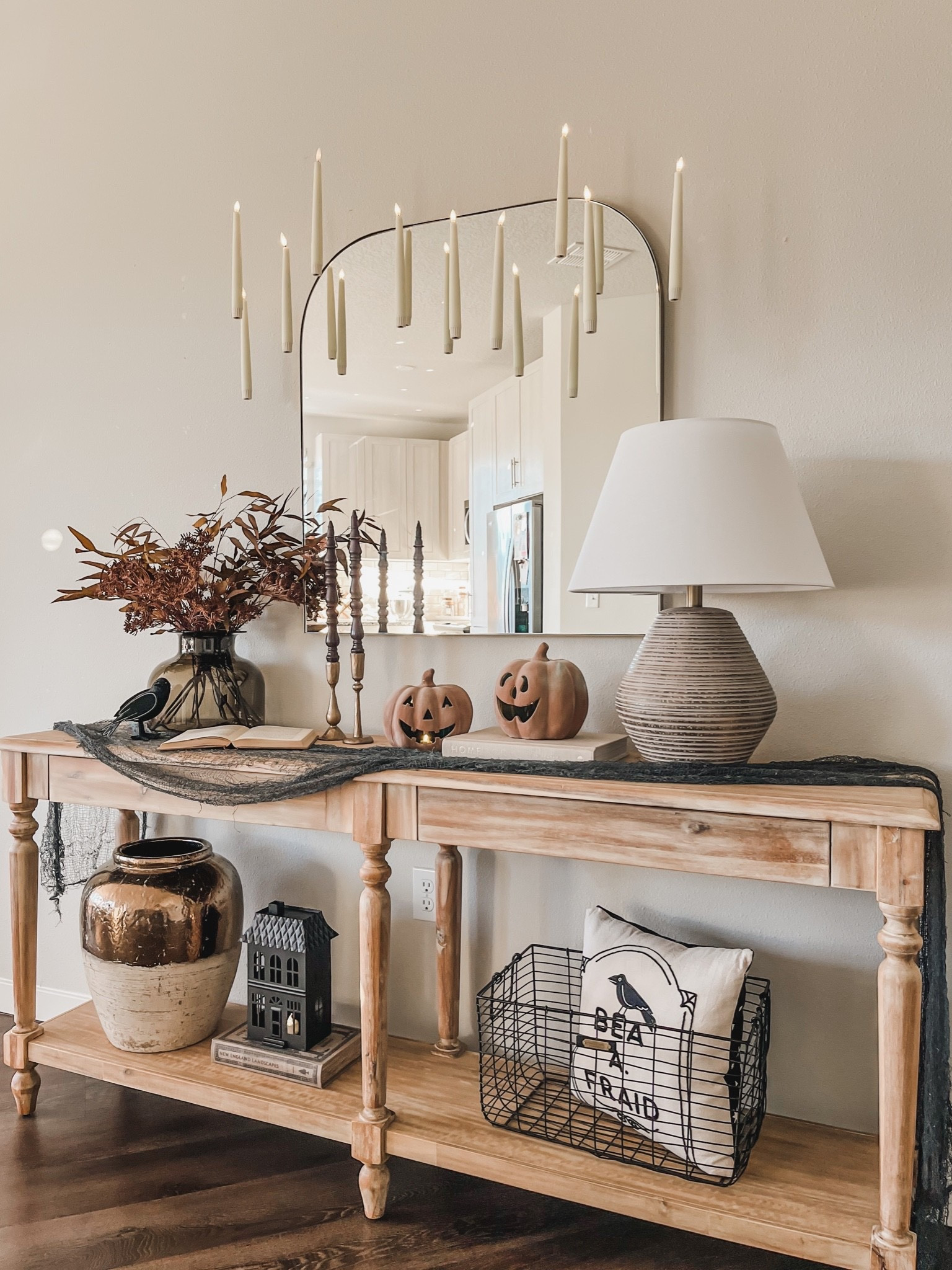 Halloween console table, Halloween decor, floating candles. 

#LTKSeasonal #LTKhome