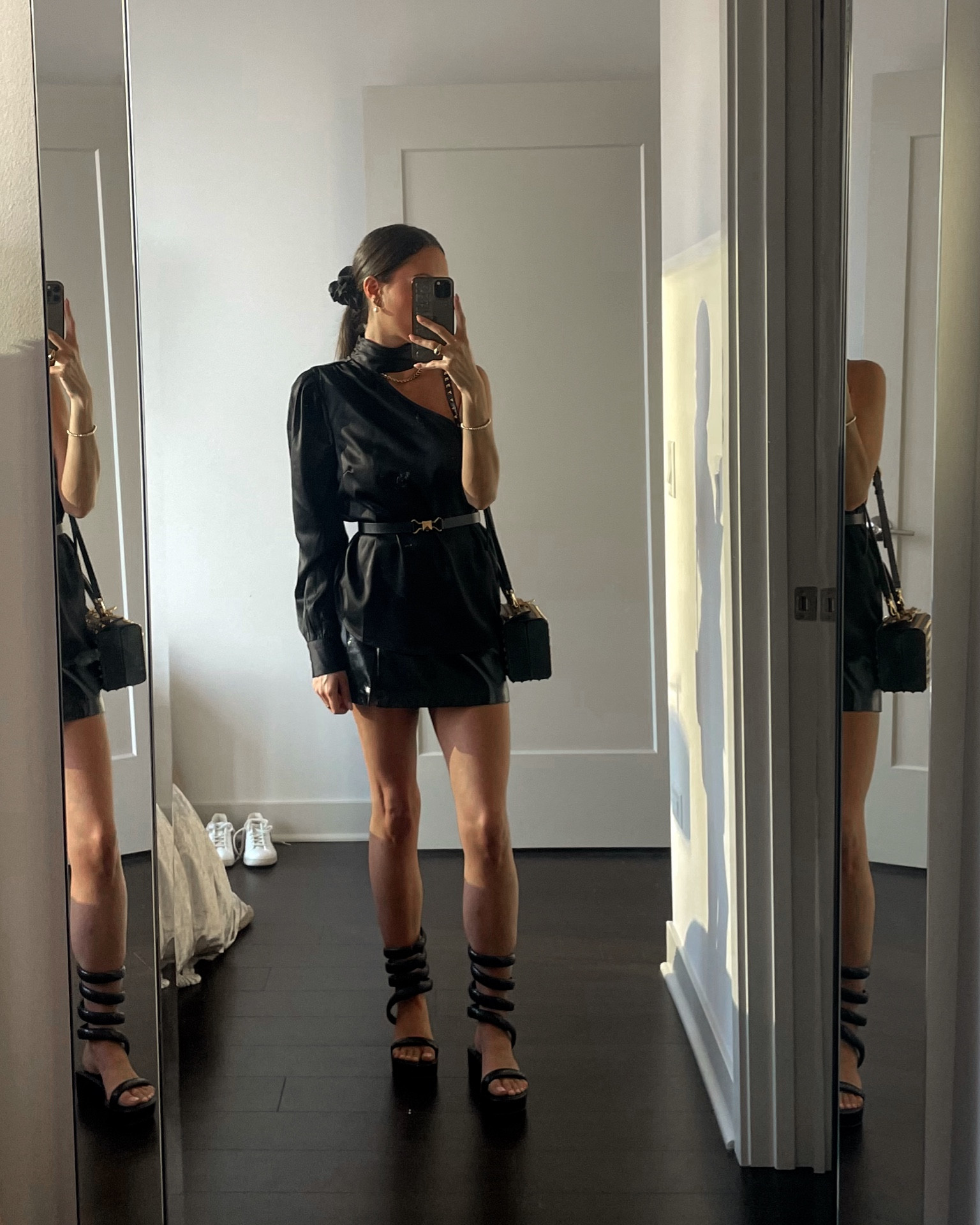 LBD Friday night fashion. One shoulder satin top, patent leather mini skirt, platform snake coil sandals, belted look, giant scrunchie, studded purse, gold chain, choker top, city style, chic looks, fancy dinner outfit 

#LTKSeasonal #LTKStyleTip #LTKShoeCrush