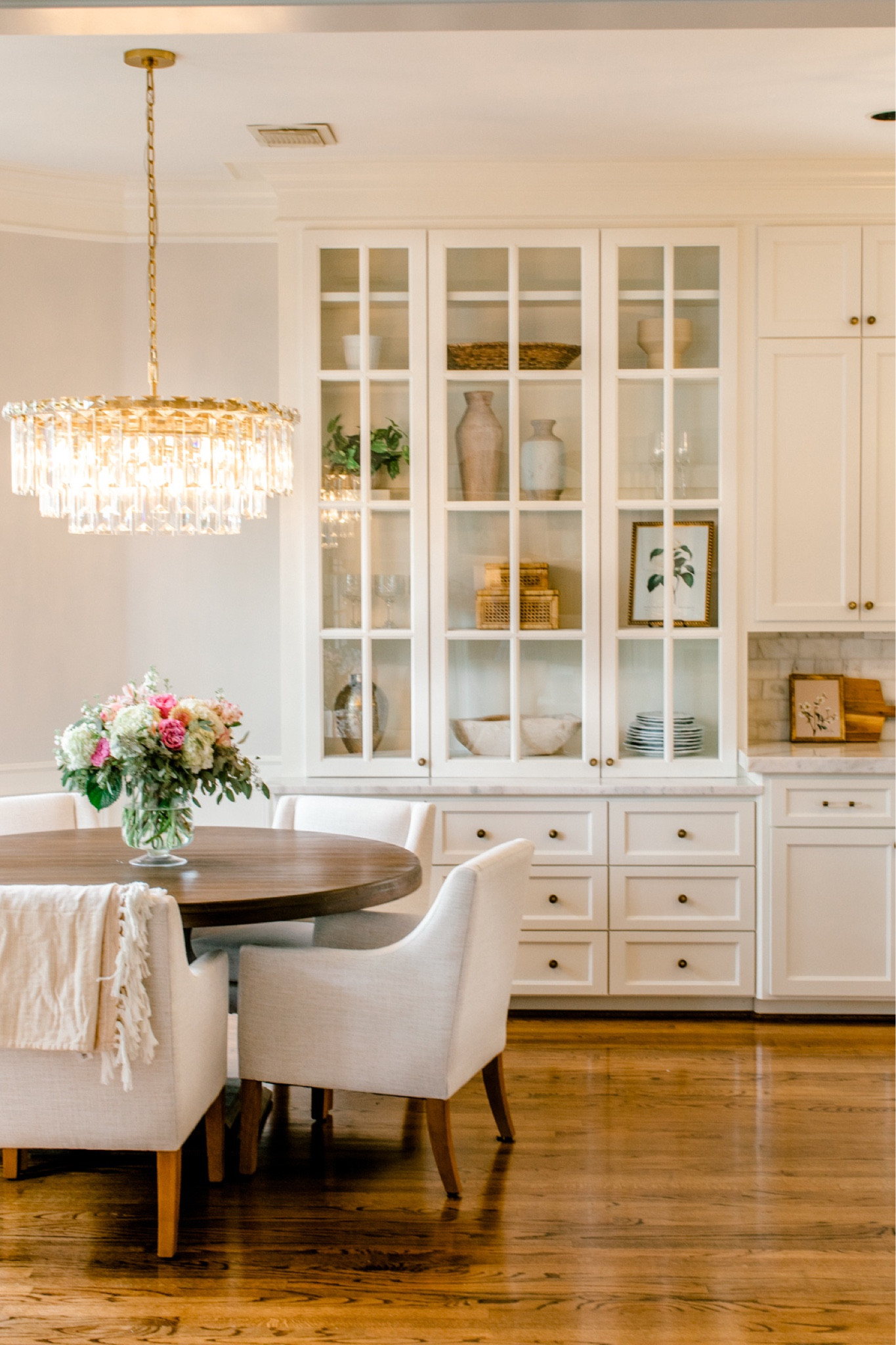 Crystal chandelier dining nook affordable dining chairs round 60” dining table antique gold knobs 

#LTKhome #LTKsalealert #LTKstyletip