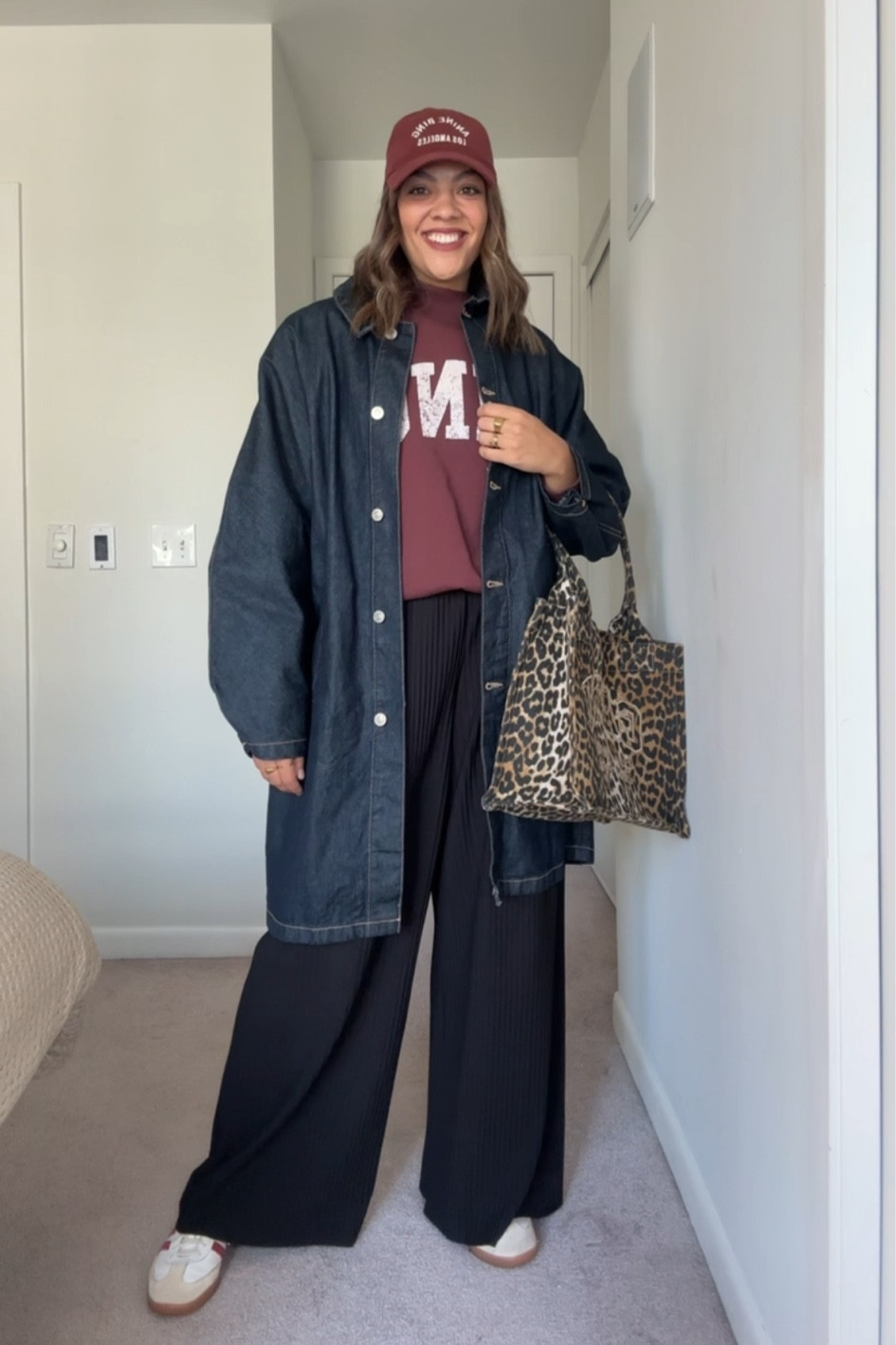 Fall outfit idea!
-Anine Bing Burgundy, oversize sweatshirt, I have a size medium.
-COS pleaded black pants, similar linked.
-Zara long denim jacket, similar linked.
-Ganni leopard print tote bag.
-Anine Bing baseball cap. Similar linked.
-Adidas samba sneakers.

#LTKstyletip #LTKcanada #LTKwedding