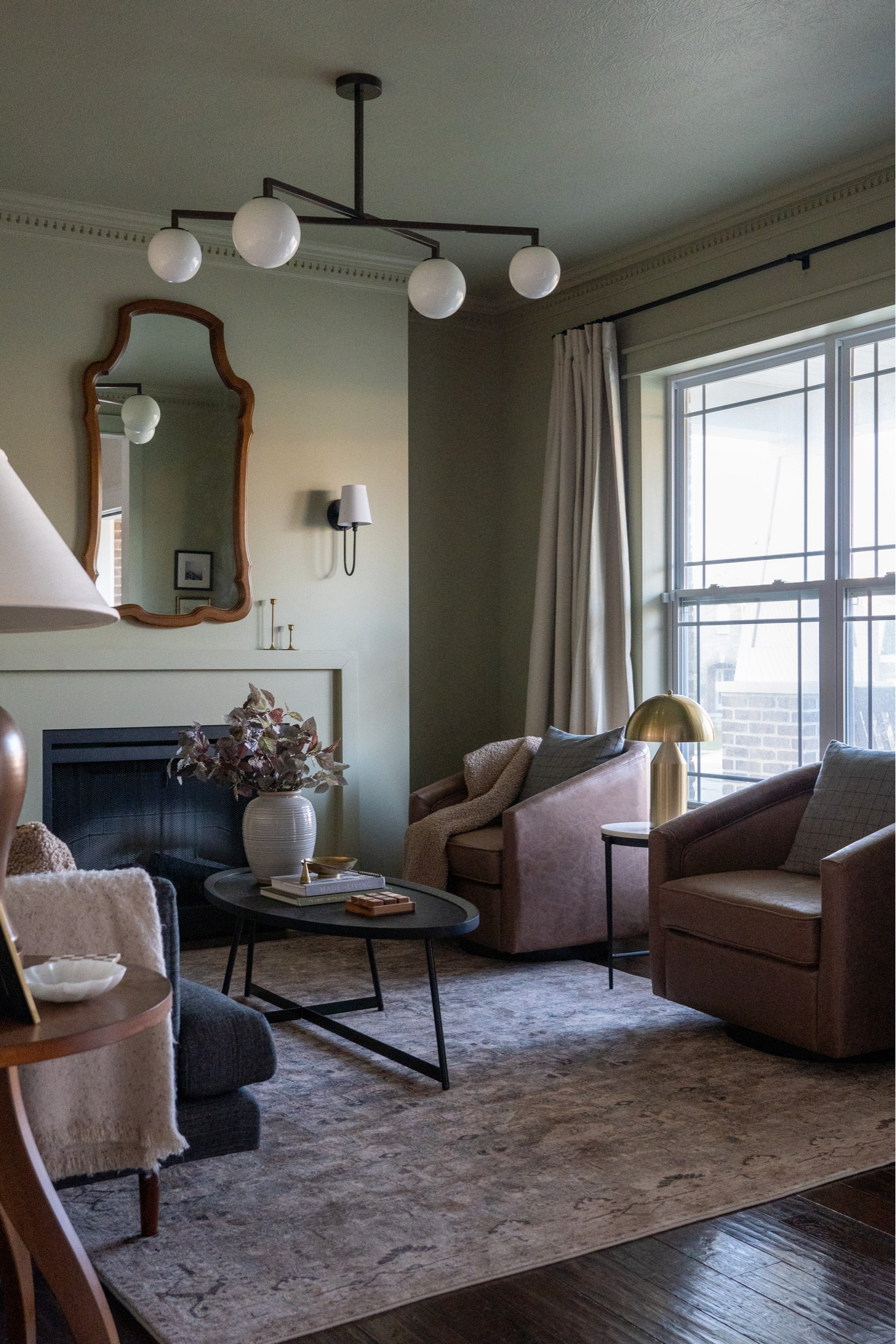 Living room decor, swivel chair, coffee table, faux flowers, sconces, lamps, rugs and more!

#LTKhome #LTKsalealert #LTKSeasonal