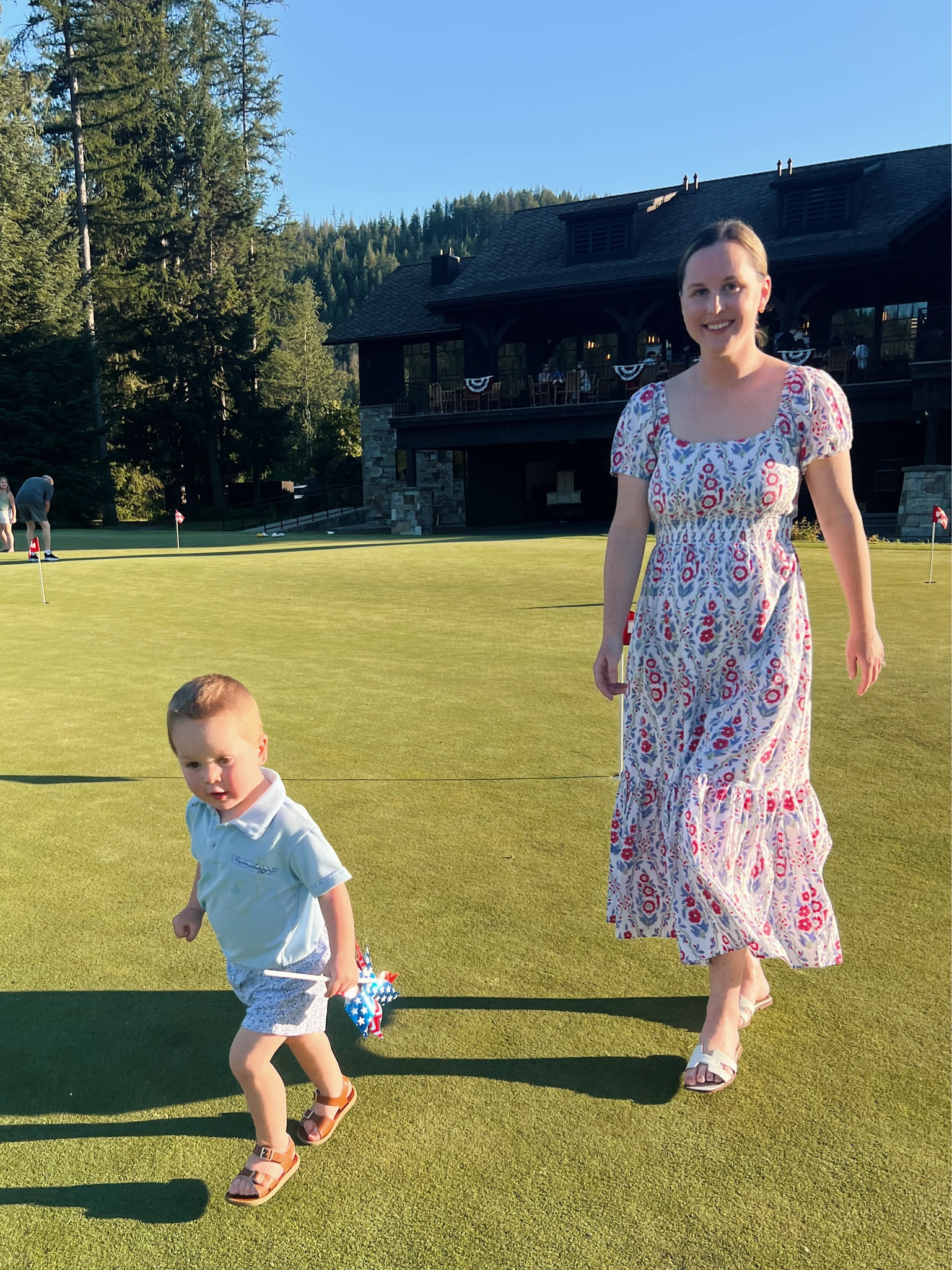 Ashley Butterfield of SideSmile Style is wearing this block print dress in a small (runs large) and her son is wearing a polo and floral shorts set in size 3T (runs TTS).

#LTKSeasonal #LTKKids #LTKFamily
