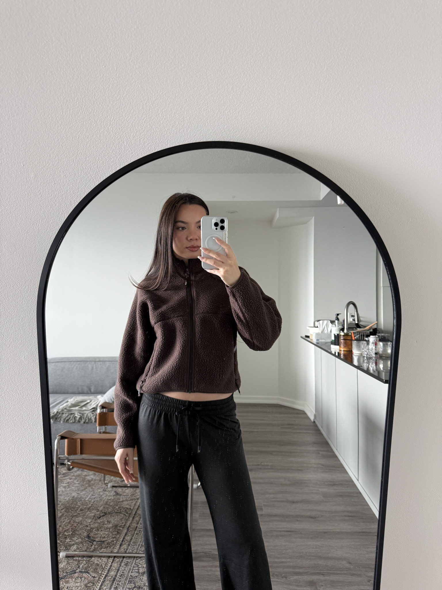 The Aritzia Polartec® Hip-Length Fleece paired with the Softbound Pants has become my go-to winter basics look — warm, soft, and minimal in the best way. The fleece has that plush, high-pile Polartec® texture that feels cozy without being bulky, and the hip-length cut gives it a clean, structured shape that sits perfectly with high-waisted pants. The stand collar and smooth zip give it that technical, modern feel, making it look more elevated than your usual fleece.

The Softbound Pants pull everything together: fluid, lightweight, and relaxed with a straight leg that falls nicely without clinging. The SoftContour waistband sits smooth and comfortable, giving the whole outfit a sleek, uninterrupted line. The mix of the deep chocolate fleece and soft black pant creates that quiet, understated palette that always looks intentional.

It’s the kind of winter outfit you throw on when you want to feel comfortable but still look put-together — soft textures, clean lines, and that effortless Aritzia simplicity.

Hashtags
#Aritzia #PolartecFleece #SoftboundPants #AritziaEssentials #MinimalStyle #WinterNeutrals #CozyOutfit #OffDutyLook #NeutralWardrobe #CanadianStyle #OOTDInspo #QuietLuxuryCasual

#LTKootd #LTKGiftGuide #LTKHoliday