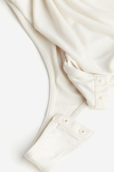 Drapierter Tangabody mit V-Ausschnitt | H&M (DE, AT, CH, NL, FI)