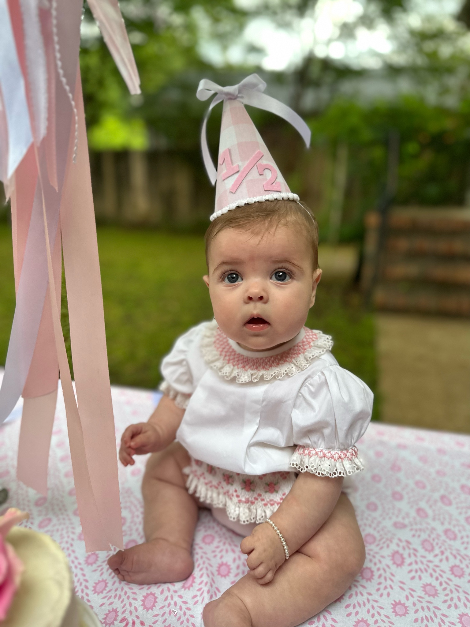 1/2 Birthday! We love every excuse to celebrate our girl. 

We made Anne Merritt’s birthday hat, but linking a similar option on Etsy! 🥳