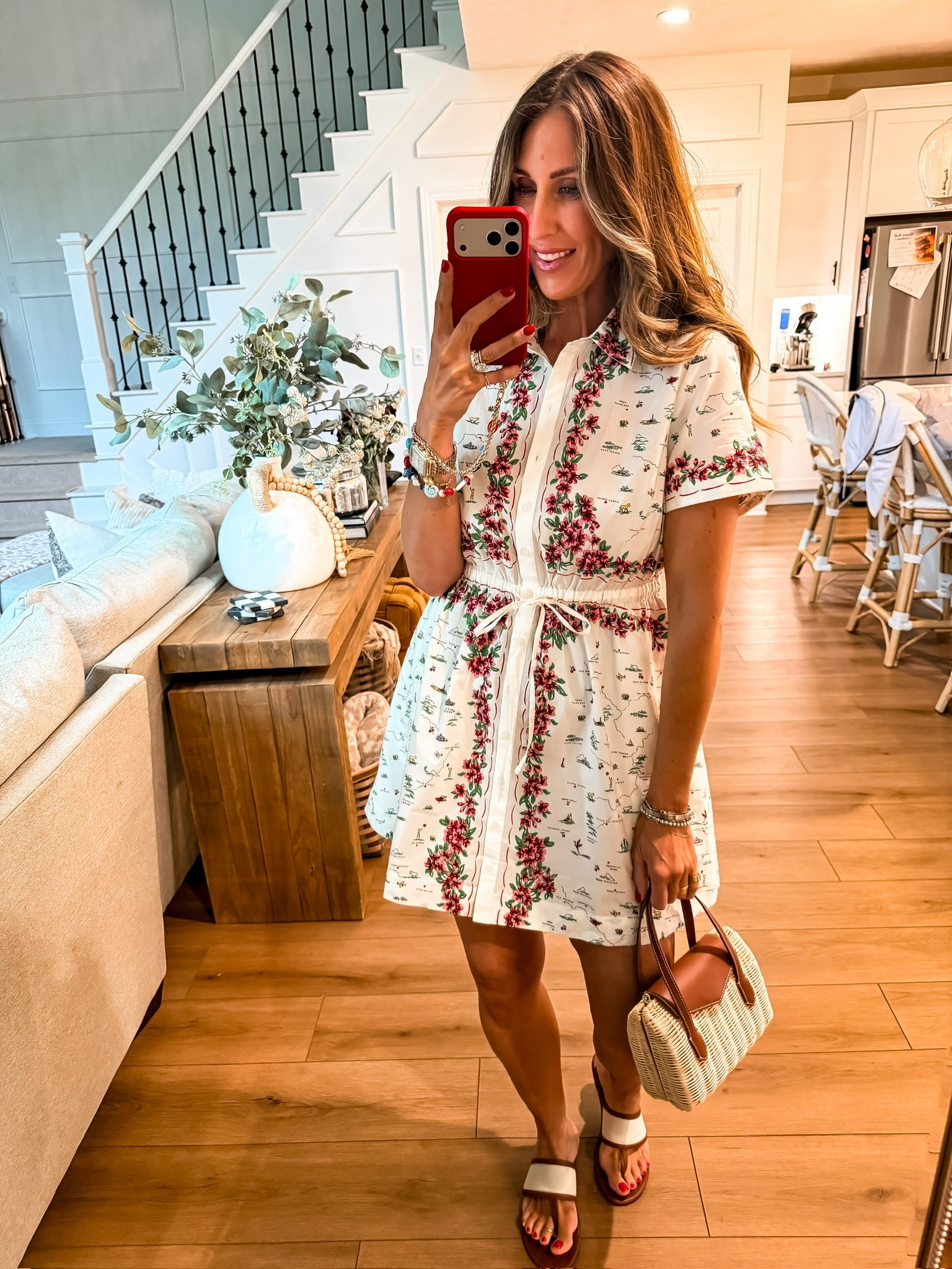 This printed shirt dress is such a unique find. I love the tailored silhouette paired with the feminine floral details, and the adjustable waist gives it a flattering fit. It feels polished enough for brunch, vacation, or summer events, but still easy and comfortable for everyday wear.

floral shirt dress, summer dress, vacation outfit, resort wear, feminine style, casual chic outfit, brunch outfit, floral print dress, woven handbag, vacation fashion, summer wardrobe staple, everyday dress, effortless style, themominstyle

#LTKootd #LTKSeasonal #LTKOver40