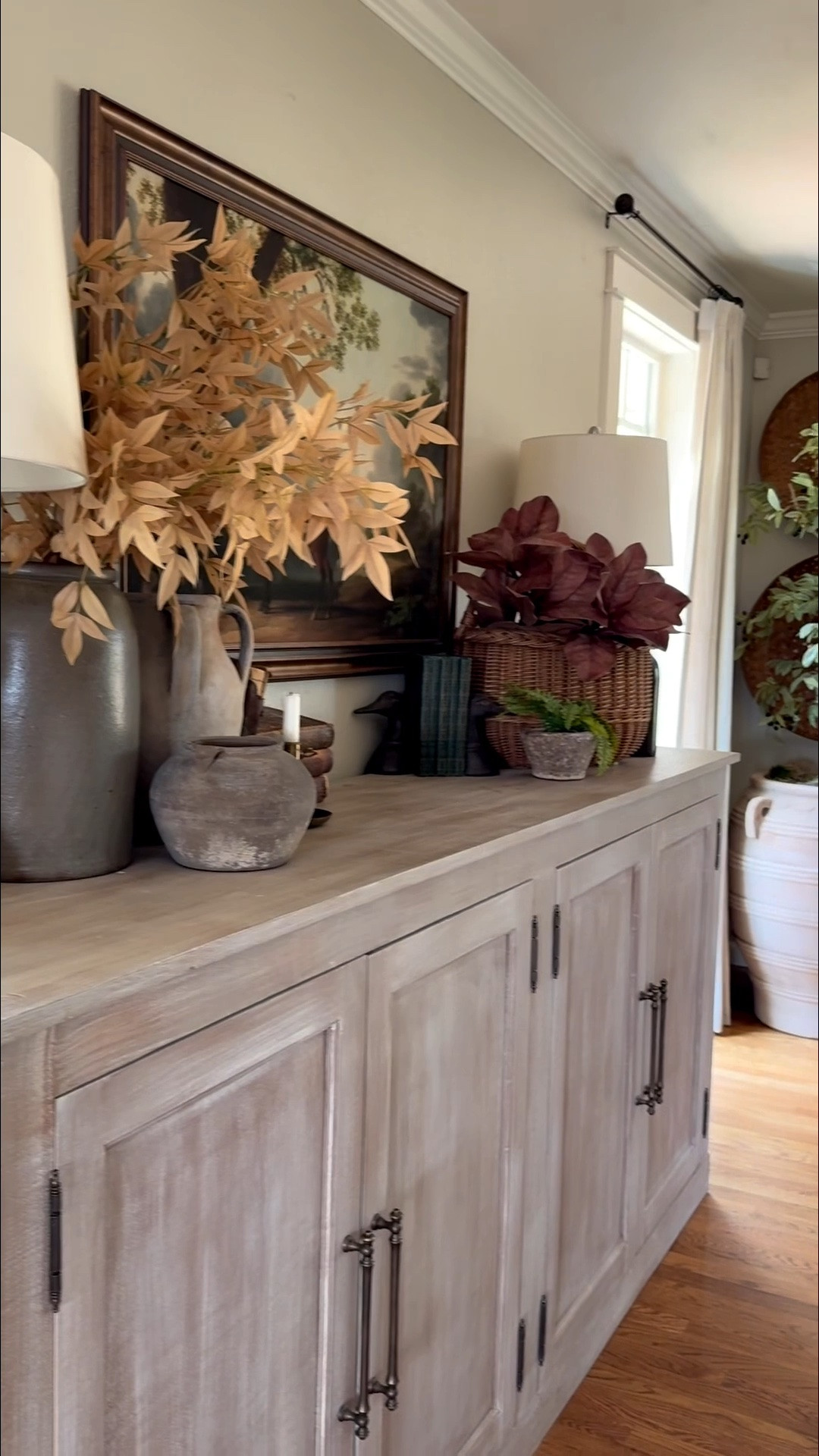 There’s something so grounding about transitioning a sideboard for autumn. Rather than starting from scratch, I love layering in moody landscape art, rich brass accents, and collected vintage stoneware that feels gathered over time. Adding deep, earthy foliage and warm glowing tapers instantly brings that quiet, cozy depth into the space. A few small, intentional shifts are all it takes to welcome the new season. 🍂 vintage interior styling | autumn home aesthetic | moody decor | cozy fall spaces

#LTKSeasonal #LTKHome #LTKstorytime