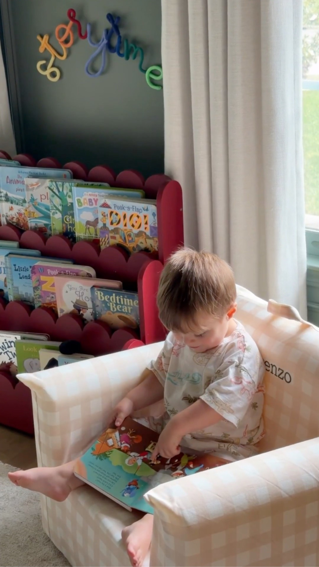 This nursery reading corner has my whole heart! The red accent wall in Wild Currant by Sherwin Williams makes the whole space feel so special and cozy — everything we used is linked!

kids reading nook, scalloped bookshelf, gingham kids chair, Loloi rug, gold crib, nursery inspo

#LTKHome #LTKKids