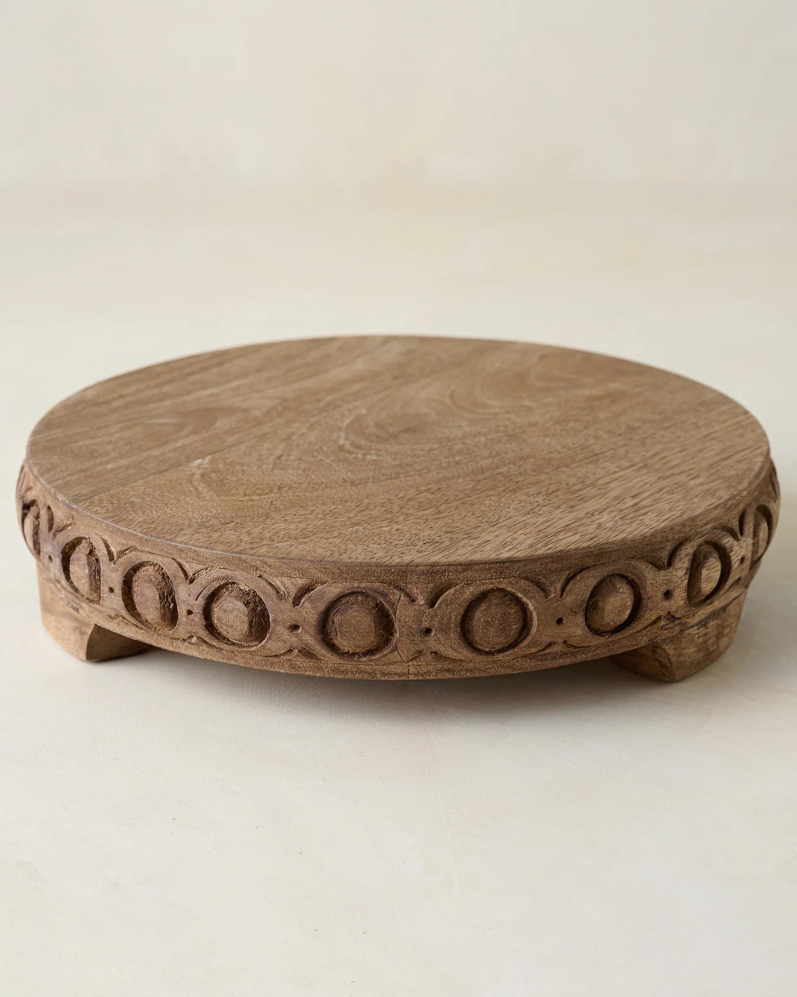 Antiqued Carved Wood Round Riser | Magnolia