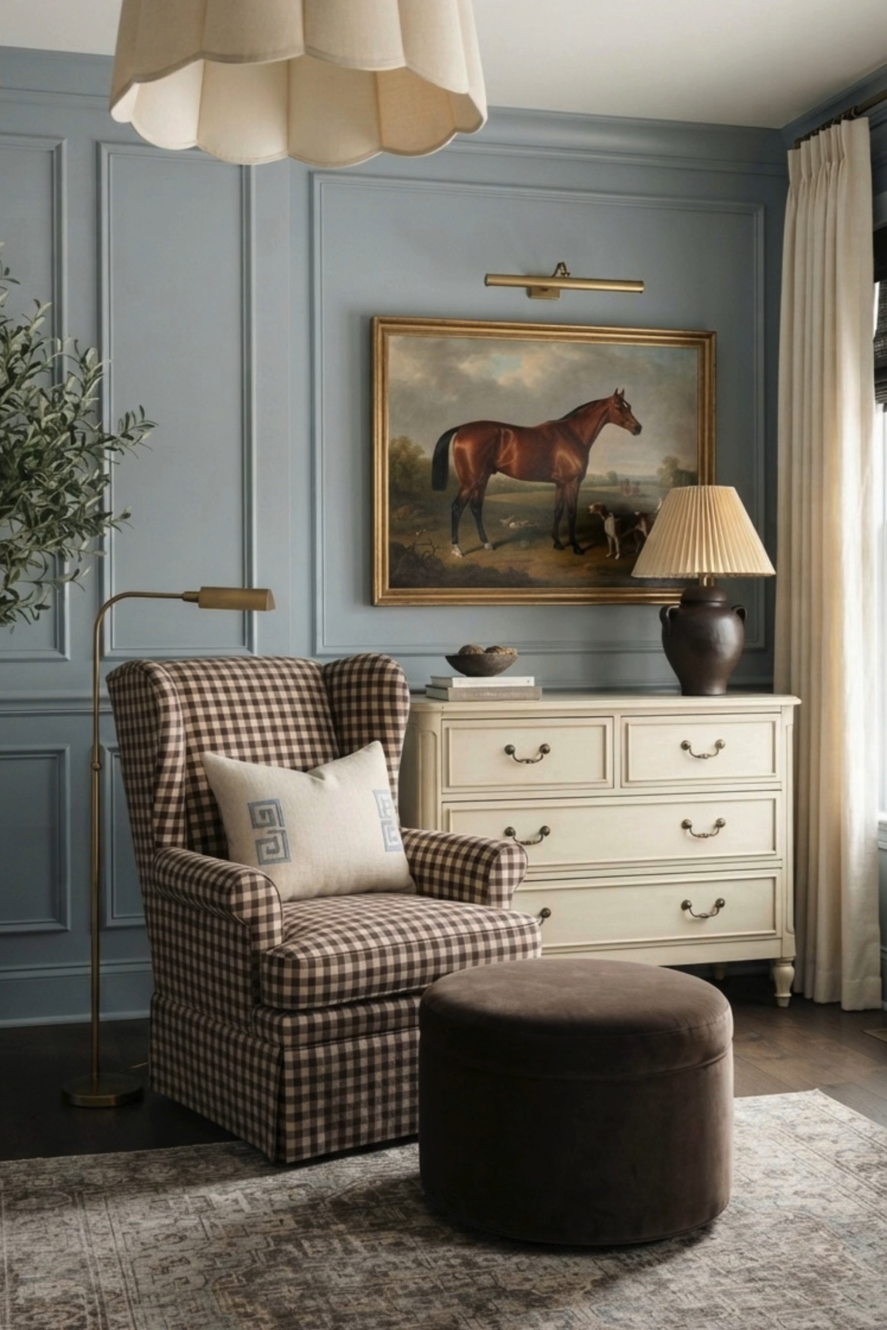 Classic English Country Reading Nook 🤎 This cozy sitting corner blends traditional English country style with timeless transitional decor, featuring soft blue-gray paneled walls, a brown gingham wingback chair, plush velvet ottoman, vintage-inspired area rug, and warm brass floor lamp. An antique-style horse painting, picture light, pleated table lamp, creamy vintage dresser, linen curtains, and potted olive tree bring collected character and an elevated old-world feel to this charming reading nook. 🖤 If you want to see more content like this, FOLLOW maeveandmodern on LTK, Instagram, and Pinterest! Check out our blog where we post daily, maeveandmodern.com! English Country Decor | Traditional Home Decor | Cozy Reading Nook | Gingham Accent Chair | Plaid Wingback Chair | Blue Gray Walls | Wall Molding Ideas | Picture Frame Molding | Vintage Horse Art | Equestrian Decor | Antique Inspired Art | Brass Picture Light | Brass Floor Lamp | Pleated Lamp Shade | Vintage Dresser | Cream Dresser | Velvet Ottoman | Brown Ottoman | Potted Olive Tree | Linen Curtains | Vintage Inspired Rug | Grandmillennial Decor | Collected Interiors | Transitional Home Decor | Old World Interiors | Cozy Home Inspiration | Traditional Sitting Room | Timeless Interior Design | Moody Traditional Decor | Cottage Inspired Home

#LTKHome #LTKBaby #LTKKids