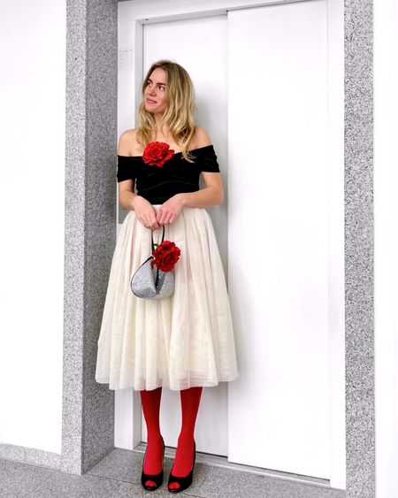 Girl with blond hair wearing cute red and pink Valentine's Day looks with tulle skirt, little black dress, red tights, rhinestone bag and flower choker. #colorfuloutfit #colorfulstyle #colorfulfashion #colorfullooks #fashionfun #cutewinteroutfit #winterfashion2023 #winterlookbook #fitcheck #dailylooks #dailylookbook #contentcreator #microinfluencer #discoverunder20k