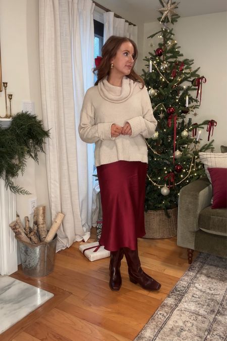 My Christmas Eve outfit this year was a cozy cream sweater, a burgundy silk midi skirt from quince my favorite brown leather knee high boots, and vintage style gold earrings.

#LTKHoliday #LTKSeasonal #LTKparties