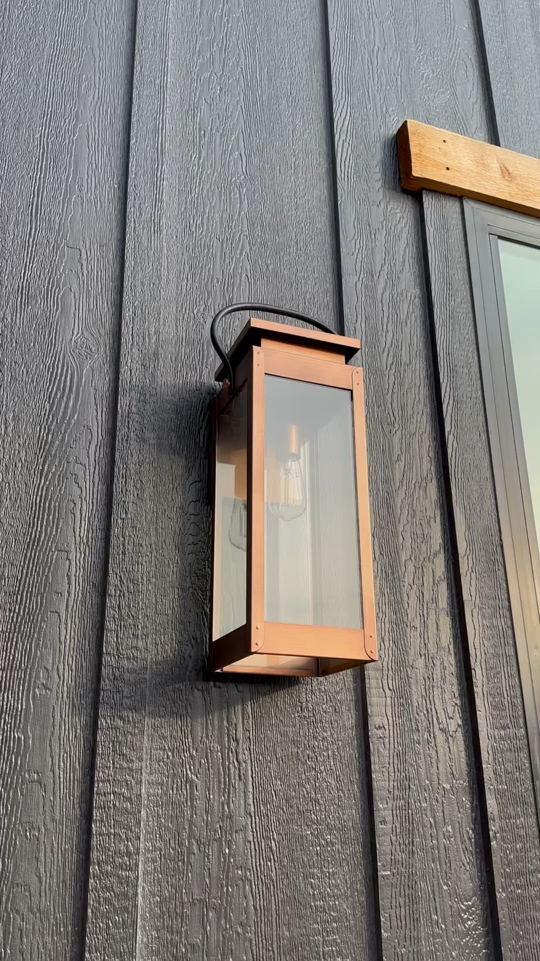 Copper exterior lantern lights — love how they contrast against the SW Caviar trim 🖤 These come in different sizes- I’m using the large size near my windows and garage  

#LTKhome #LTKVideo