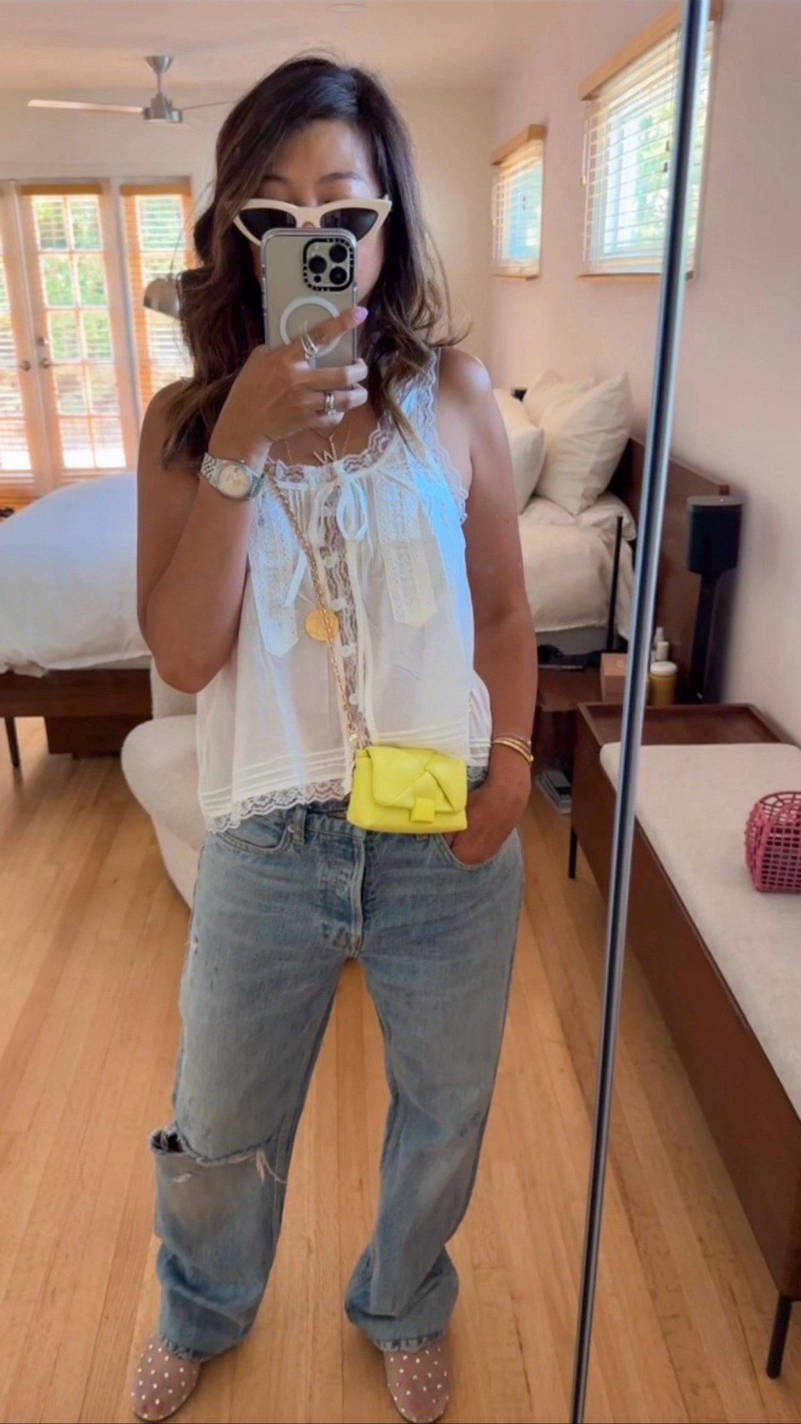Outfit of the Day 💗🟡☀️
You know it’s summer when the thought of wearing real clothes feels like too much 😂 This lacey tank gives major Free People energy and somehow makes me feel chic and cool… even when I’m lowkey melting 🫠
Threw it on with some oversized distressed jeans and my fave summer combo: the pink Fendi jelly bag + my tiny fluorescent yellow micro bag that’s doing the most! It’s a crossbody and a bag charm 🙌 A little neon, a little nostalgia, and just enough pop to make my neutrals feel fun 💕 
Tank (size S)
Jeans (size 27)
Shoes (size 6.5)

#LTKItBag #LTKSeasonal #LTKStyleTip