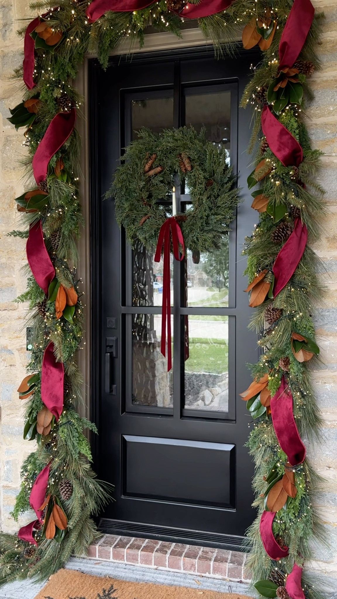 Here’s how I created this gorgeous Christmas garland around our front door!

The two type of garland I used are old from Hobby Lobby. One is no longer sold in stores so I’m linking to other similar garlands in stock.

The magnolia stems are real from my local grocery store, but you could also use faux.

✨ These are my viral Christmas lights, they’re indoor/outdoor and have the prettiest clusters of lights!

#LTKHoliday #LTKHome