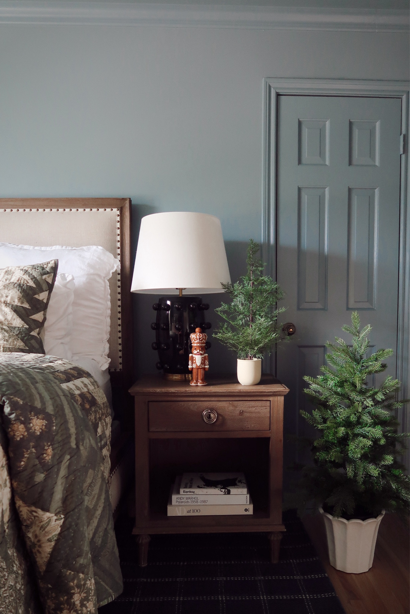 Creating a holiday retreat in the bedroom doesn’t have to be complicated. Start with warm, layered bedding in rich, timeless tones, and add a few small touches like a classic nutcracker or mini evergreen trees for understated charm. Soft textures and simple greenery bring that cozy holiday feel without overwhelming the space. A softly scented candle would be a perfect finishing touch. Who doesn’t love a little holiday spirit to unwind in? 🎄✨

home decor, holiday decor, bedroom decor, bedroom inspiration, classic holiday decor, pottery barn 

#LTKHoliday #LTKSeasonal #LTKHome