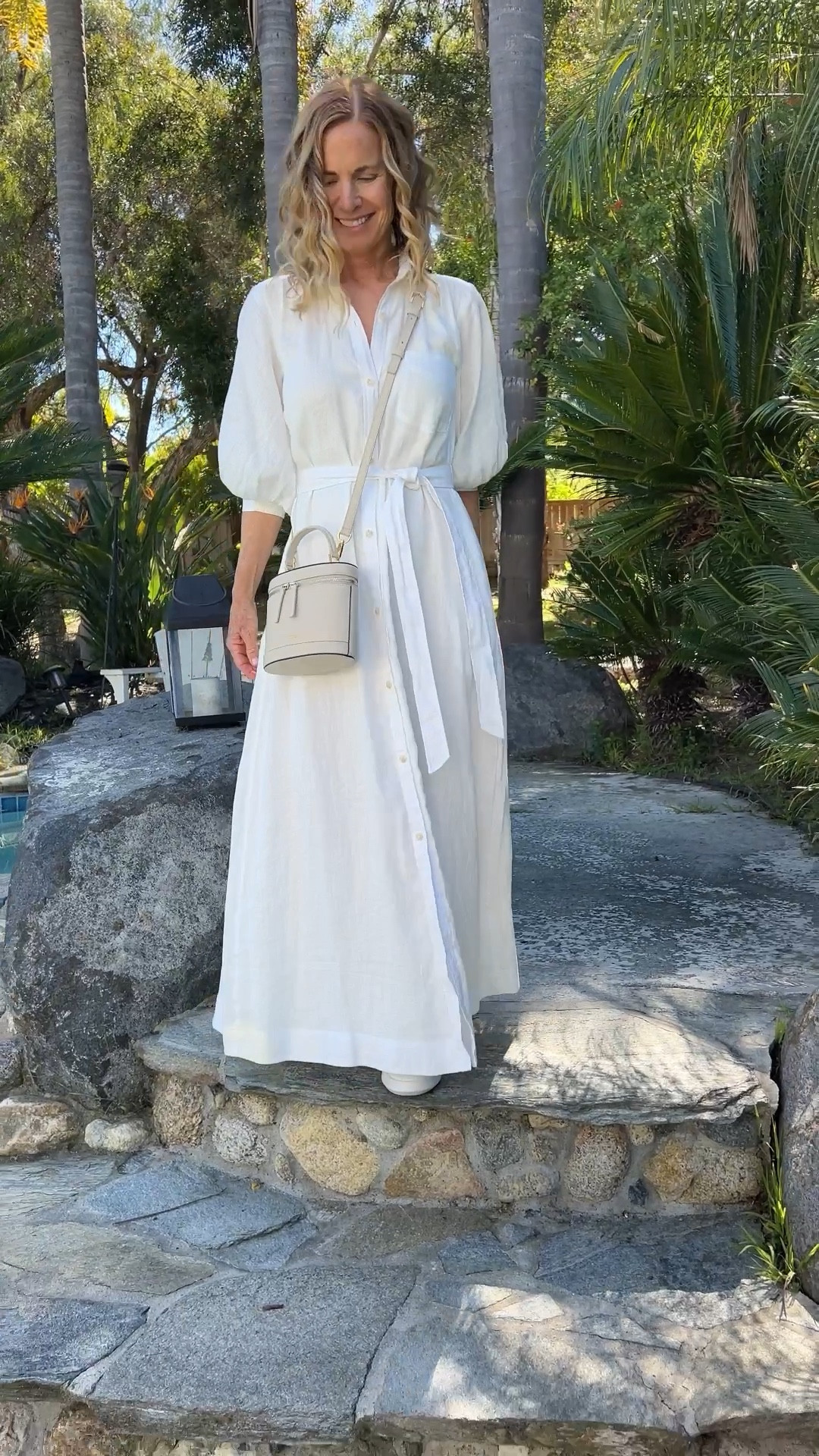 My Most Popular White Dress! This sold out last year! I paired it with my go-to white leather sneakers and a beautiful crossbody purse. 🤍 #whitedress NOTE: shoes linked show “blue” but when you click through you’ll see white. #LTKover40 

#LTKSeasonal #LTKVideo