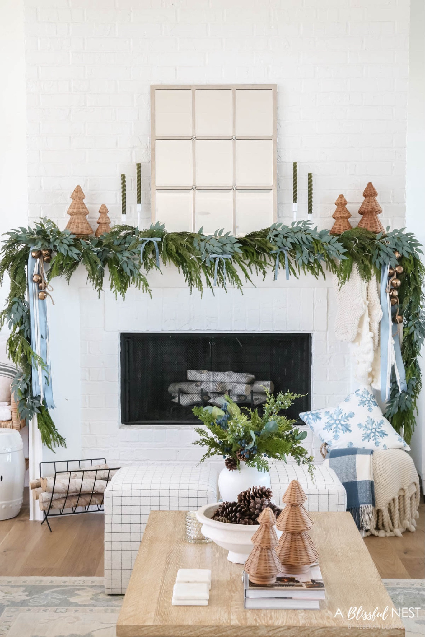 My Christmas mantel with soft blue and sage green accents. Featuring the viral rattan trees, green tapered candles, pottery barn mirror, Norfolk pine garland, mixed greenery garland, holiday coffee table decor, Christmas pillows. 

Christmas home tour, Christmas mantel, Christmas decor, holiday home tour, coastal style, coastal decor 

#LTKHome #LTKSeasonal #LTKHoliday