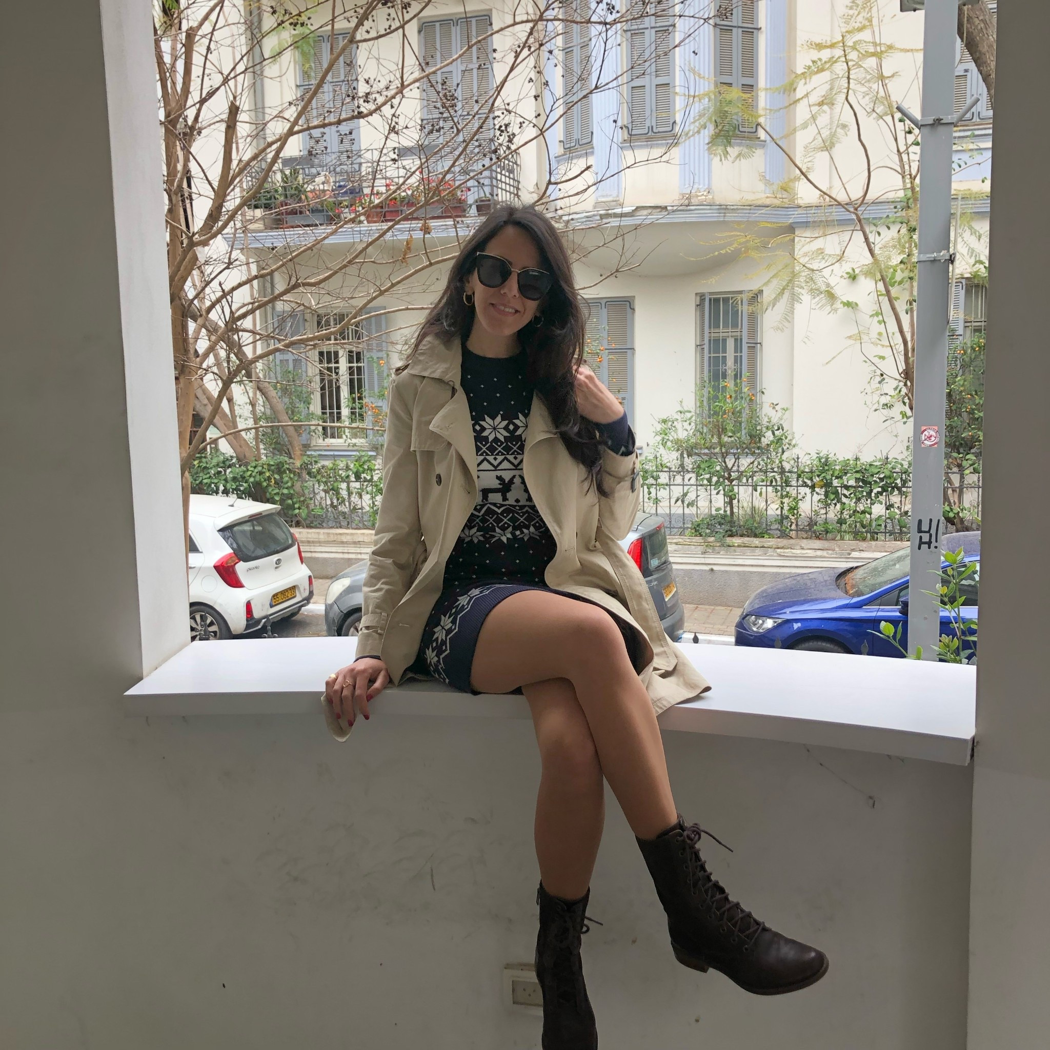 Such a comfy winter look with Christmas vibes  I threw on this fair isle knit dress with a light trench and my go-to combat boots. Added simple hoops and sunglasses and it turned into the easiest city outfit for a chilly day.