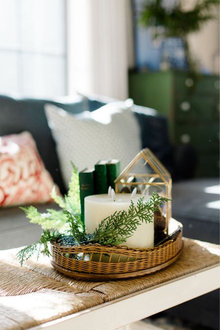 Simple winter decor! Greenery, vintage tray, battery operated candle, terrarium and books on our coffee table. Cozy vibes!

#LTKhome #LTKfindsunder50 #LTKSeasonal
