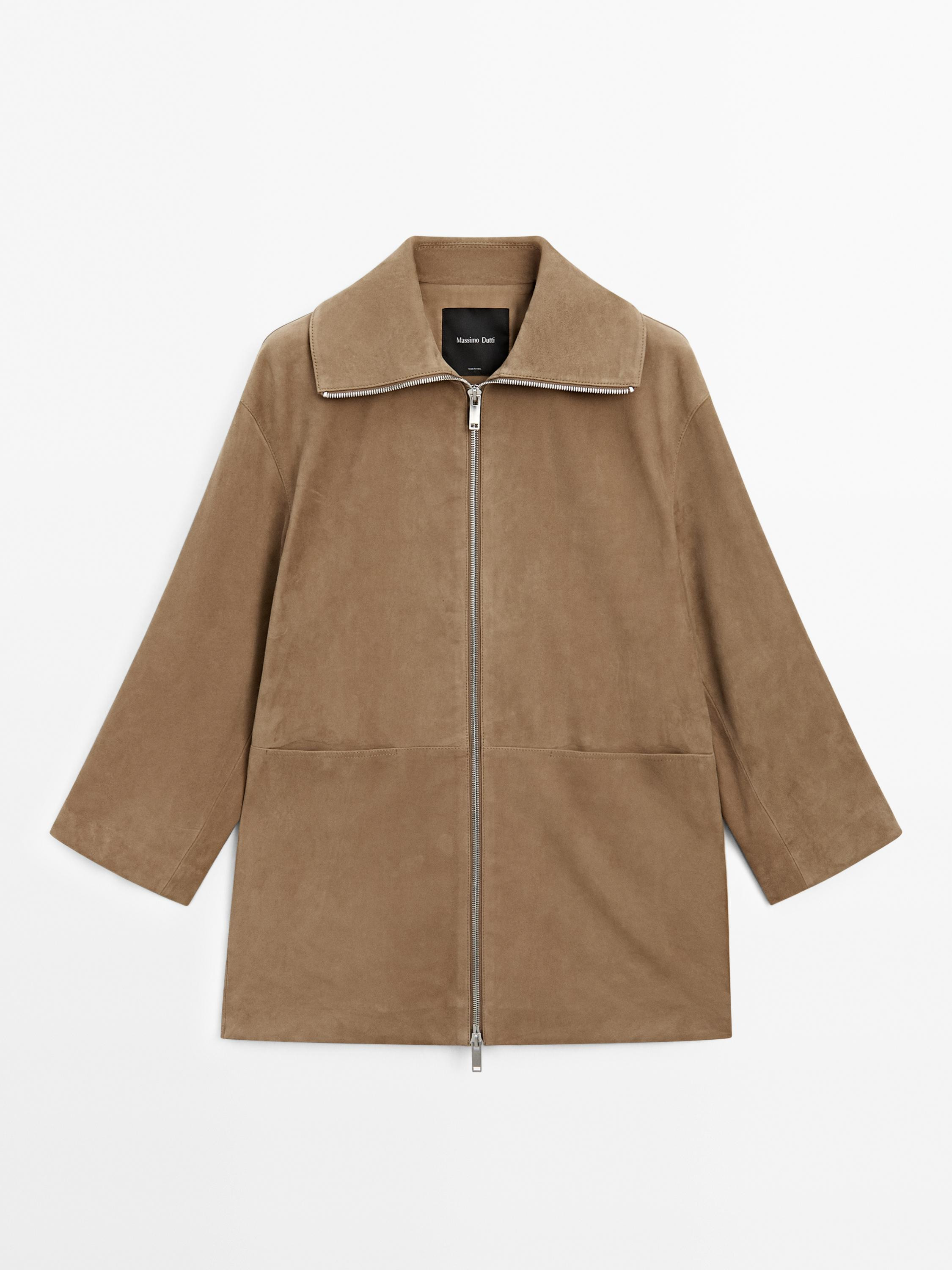 Long coat made of goatskin with suede finish. Long sleeves. Zip fastening. High collar. Two besom... | Massimo Dutti UK