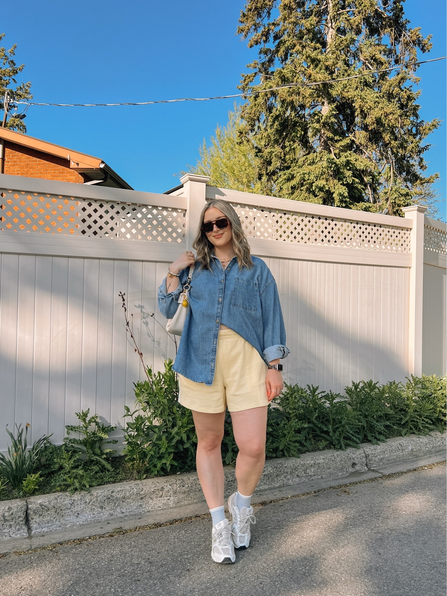 Comfy casual spring to summer outfit! Wearing my usual size L in both the denim shirt and butter yellow shorts. Canadian Old Navy links are under “similar products”. New Balance sneakers are so comfy for walking but run a little big, I’m a 9.5-10 and wear a 9.

#LTKmidsize #LTKsummer #LTKsale