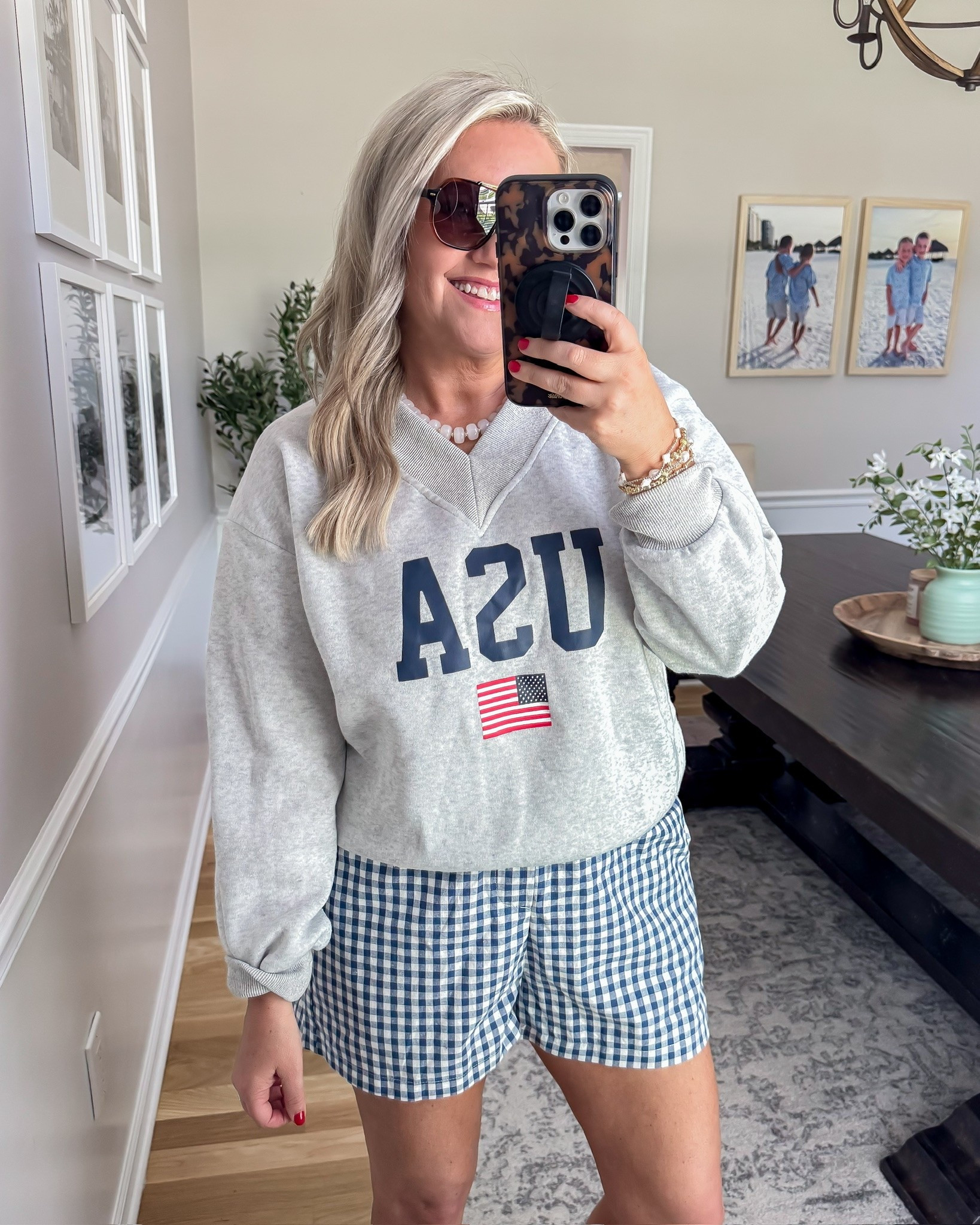 This might be one of my favorite patriotic outfits lately 🇺🇸 The oversized USA sweatshirt with the blue gingham shorts gives that cozy Americana look while still feeling lightweight enough for summer nights, lake weekends, and fireworks with the family.

usa sweatshirt outfit, patriotic summer outfit, gingham shorts outfit, americana style, casual fourth of july outfit, comfy summer fashion, memorial day outfit idea, oversized sweatshirt look, cute patriotic style, affordable amazon fashion, casual everyday outfit, red white and blue fashion, lovelylifestyling

#LTKSeasonal #LTKOver40 #LTKootd