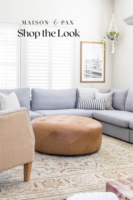 Looking for some fresh and airy decor ideas for your family room? These simple items will help refresh the room your family spends time in. Blue couch, leather ottoman, wing back chair 

#LTKhome #LTKfamily