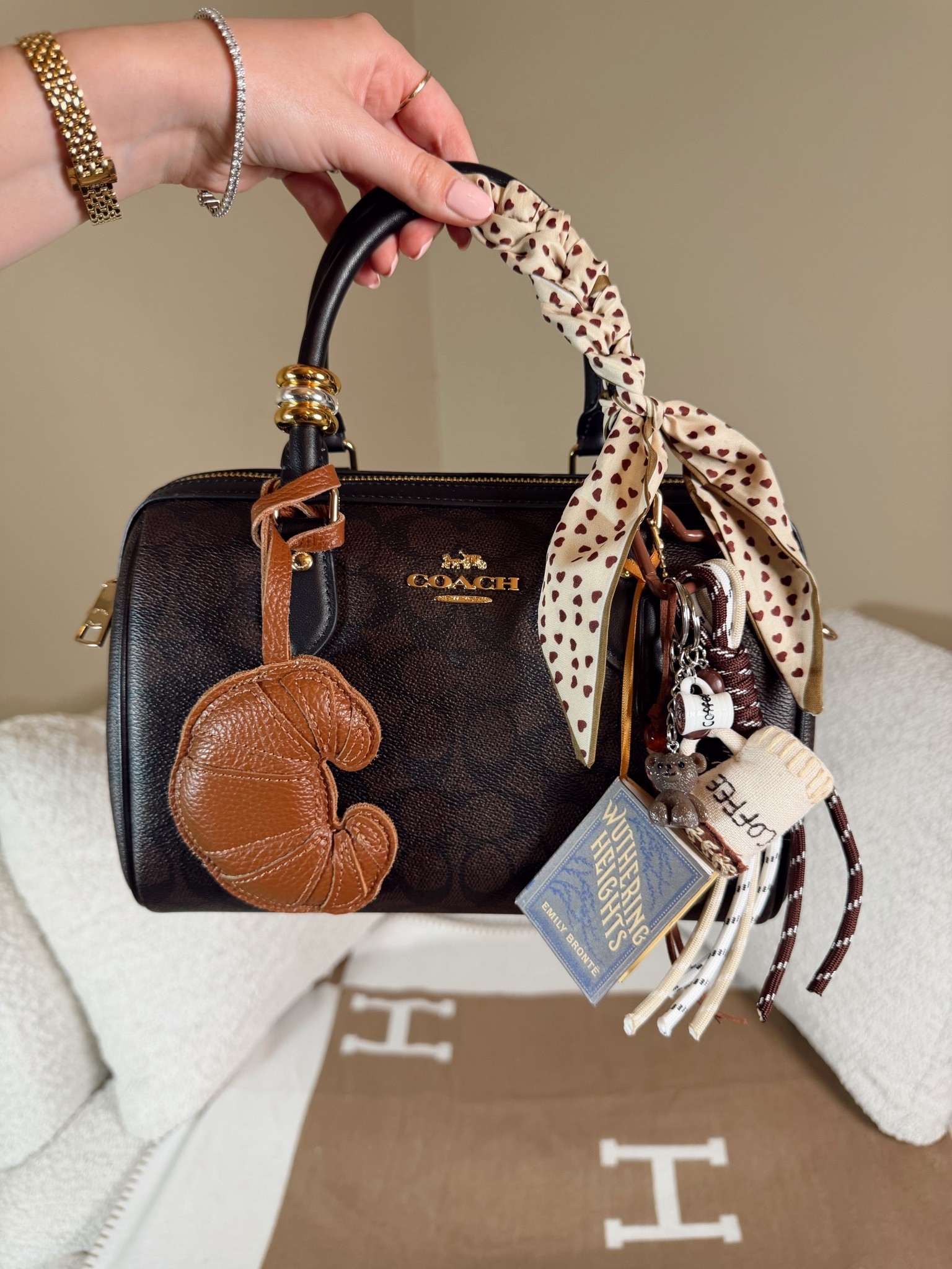 Coach Rowan 
Croissant bag charm
Coffee bag charm
Wuthering heights book charm
Coach outlet 